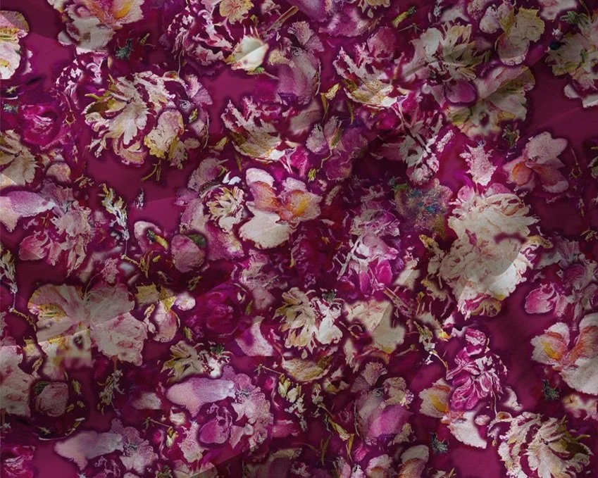 Pink floral fabric pattern with various intricate flowers.