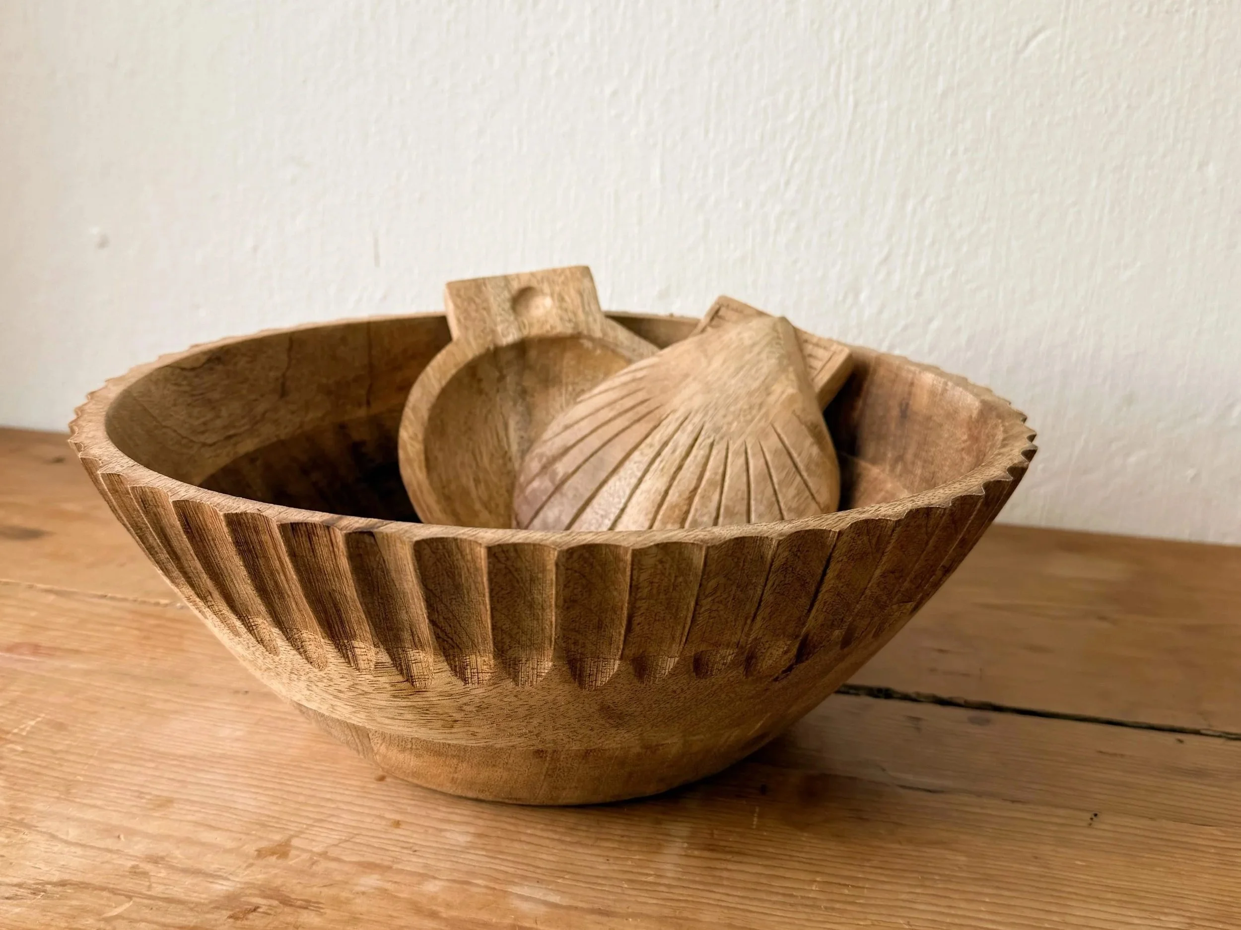 5-inch hand-carved mango wood shell-shaped salad servers by Sukha Space