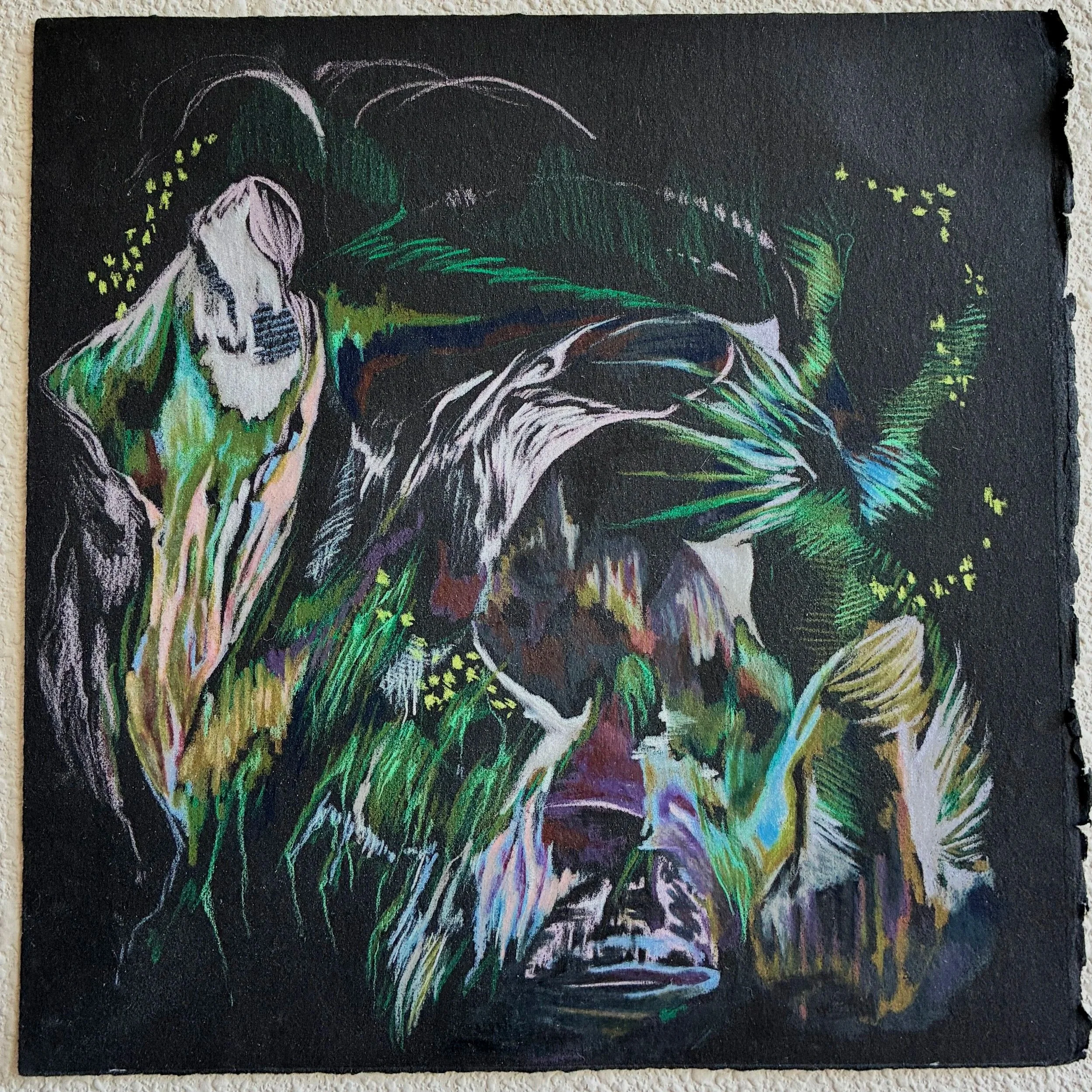 Colorful chalk drawing on a black chalkboard with leaves and flowers.