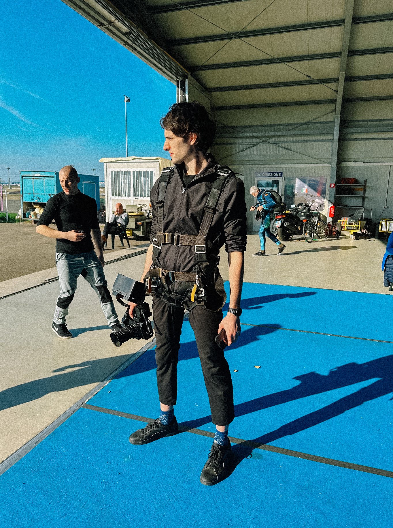 Person holding a stabilizer in an aircraft hangar