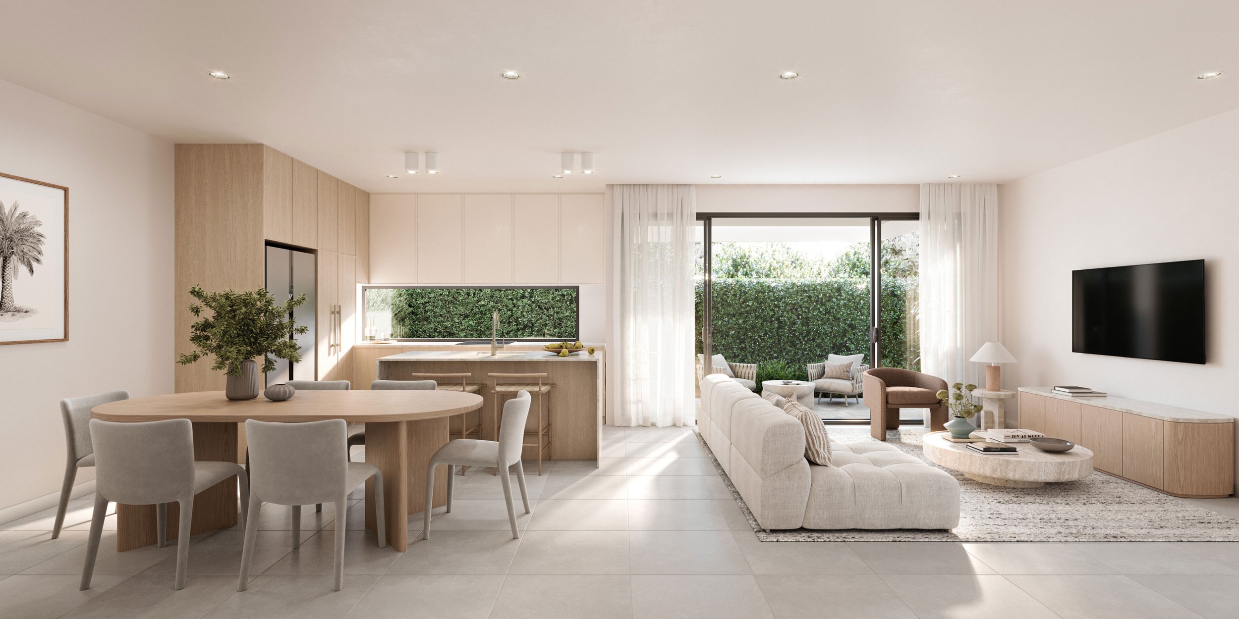 Modern open-concept living room and kitchen with neutral tones, featuring a round dining table with gray chairs, a beige sectional sofa, wall-mounted TV, and large sliding glass doors leading to a patio with greenery.