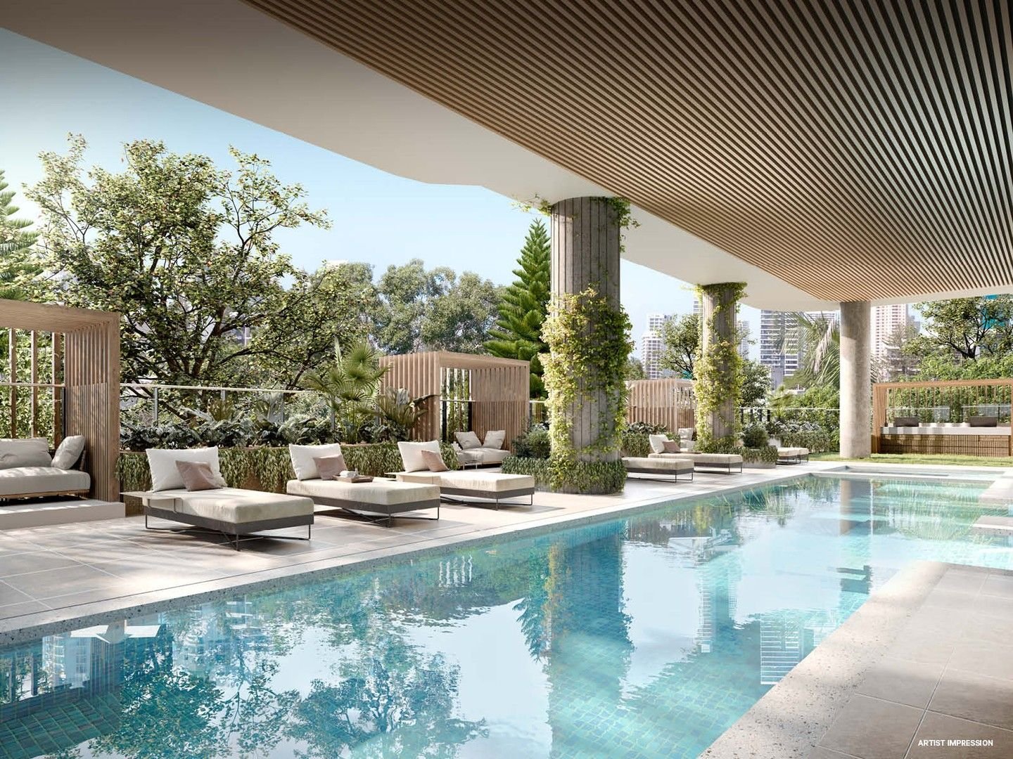 Modern outdoor swimming pool area with lounge chairs, greenery, and city skyline in the background. The ceiling has slatted wood design and there are plants on columns.
