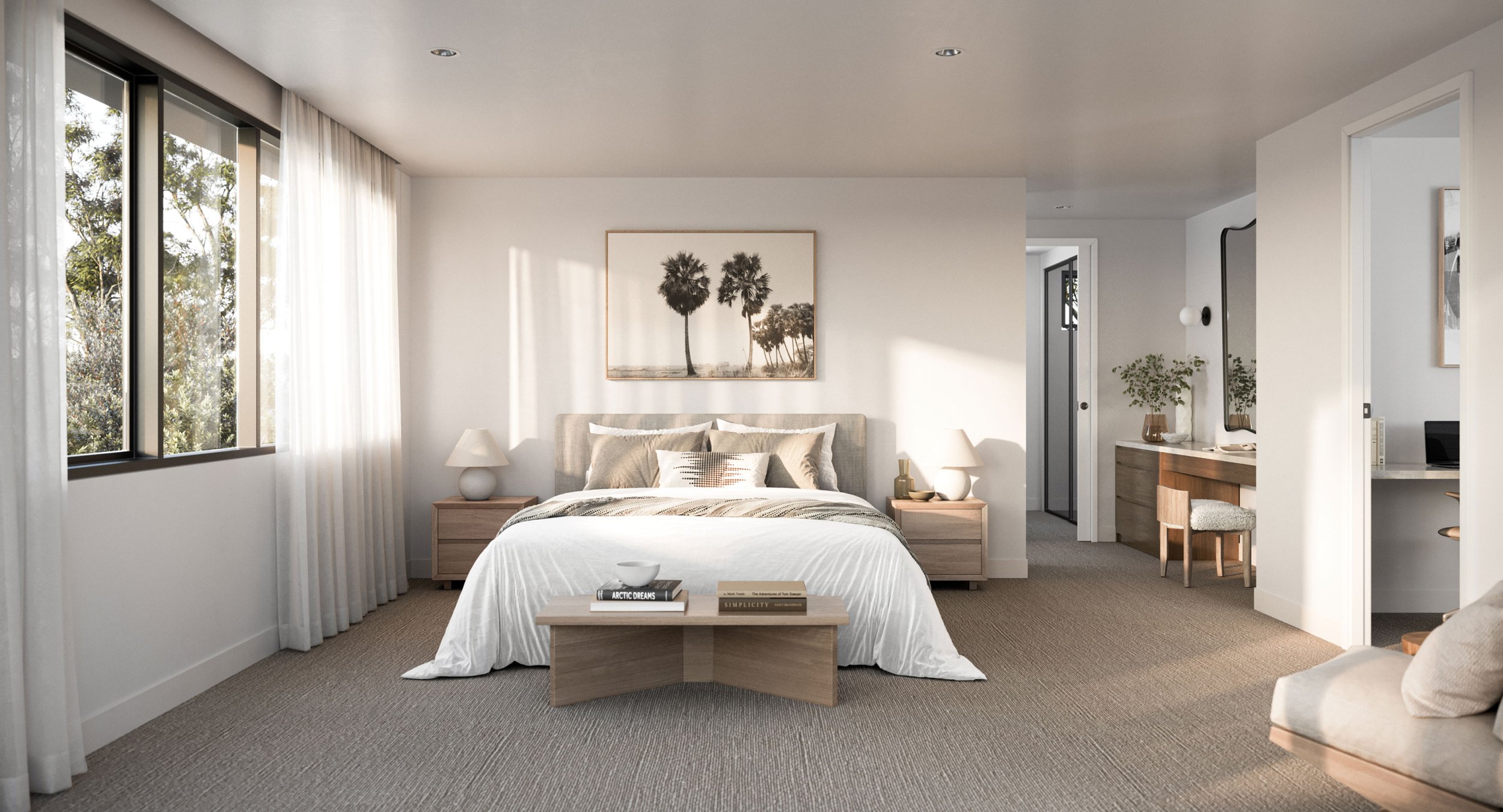 Modern bedroom with large windows, beige walls, and neutral decor. Features a bed with plush pillows, wooden nightstands, lamps, and a small table with books. A framed picture of palm trees hangs above the bed. A door leads to an adjacent space with