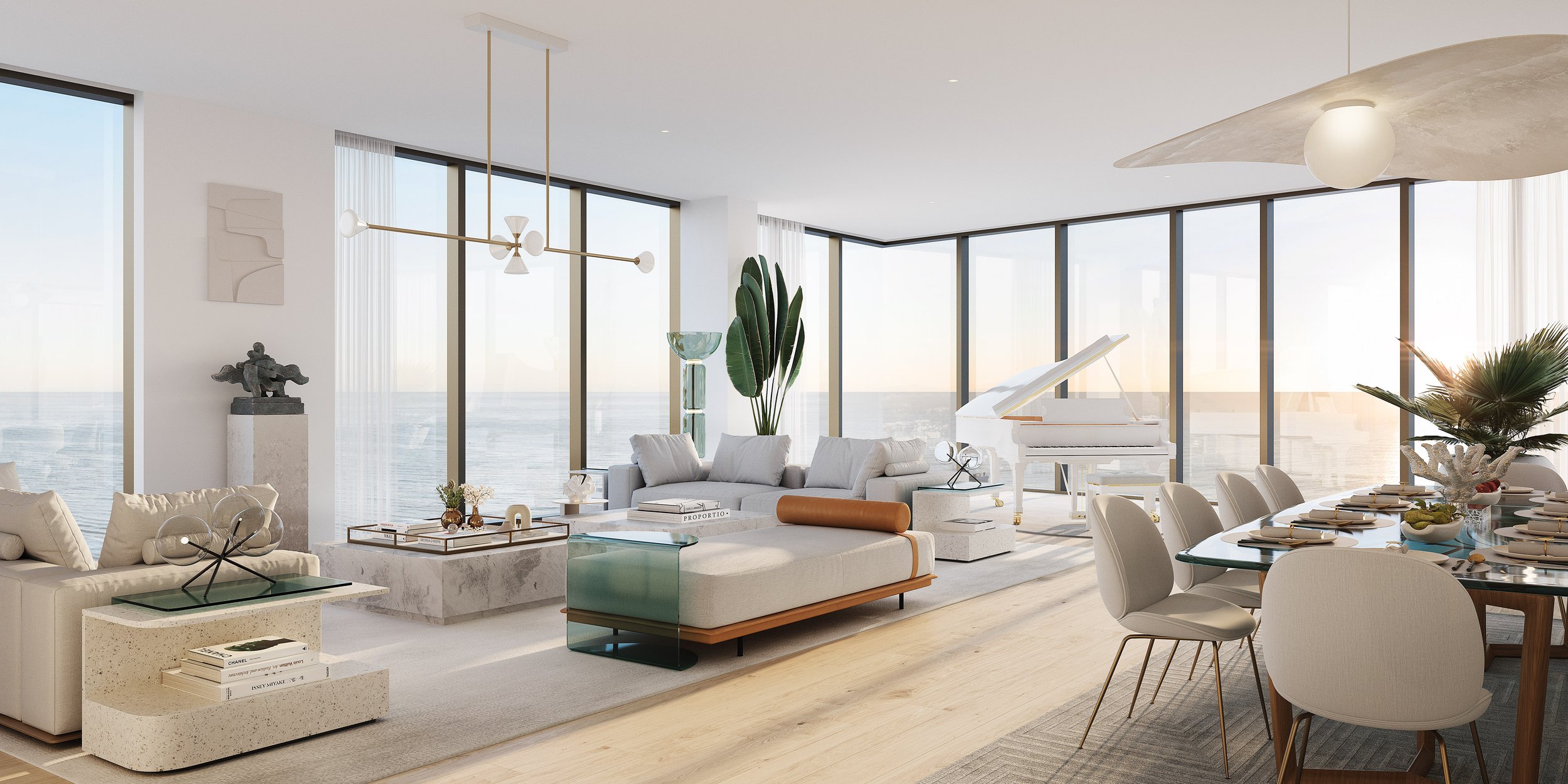 Modern living and dining area with ocean view, featuring a white grand piano, contemporary furniture, large glass windows, and a dining table set for a meal.