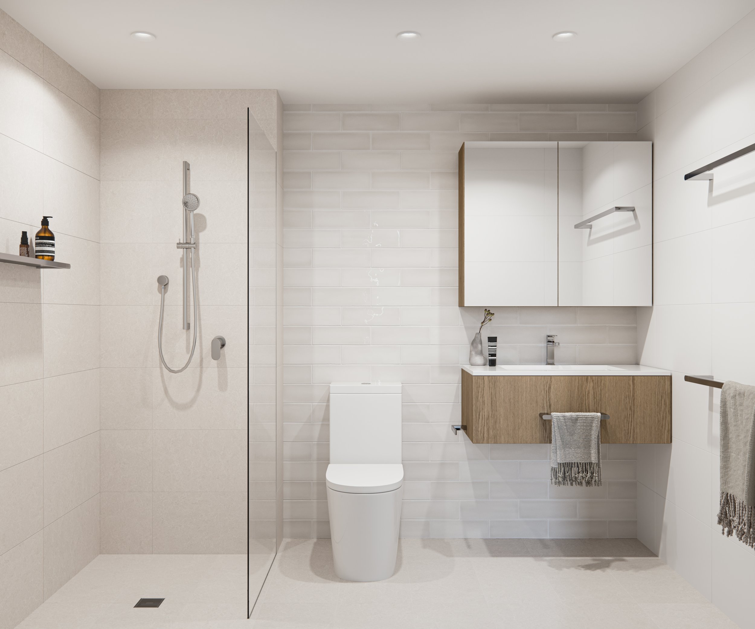 Modern bathroom with a glass shower enclosure, wall-mounted rain shower, white toilet, and floating wooden vanity with sink. The bathroom has white tile walls, ceiling lights, and a towel hanging on a rack.