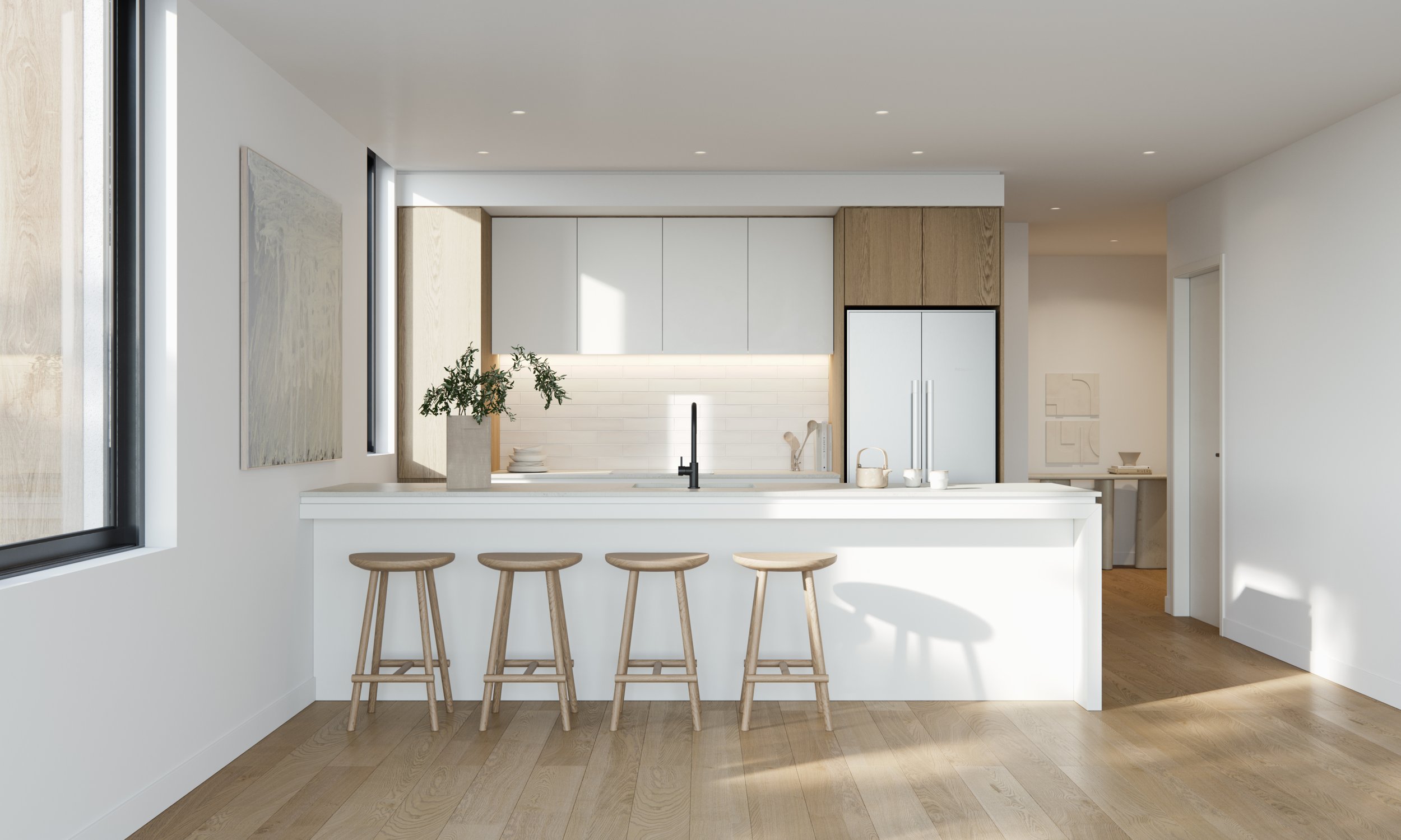 Modern kitchen interior with white cabinetry, island with stools, and wooden flooring.