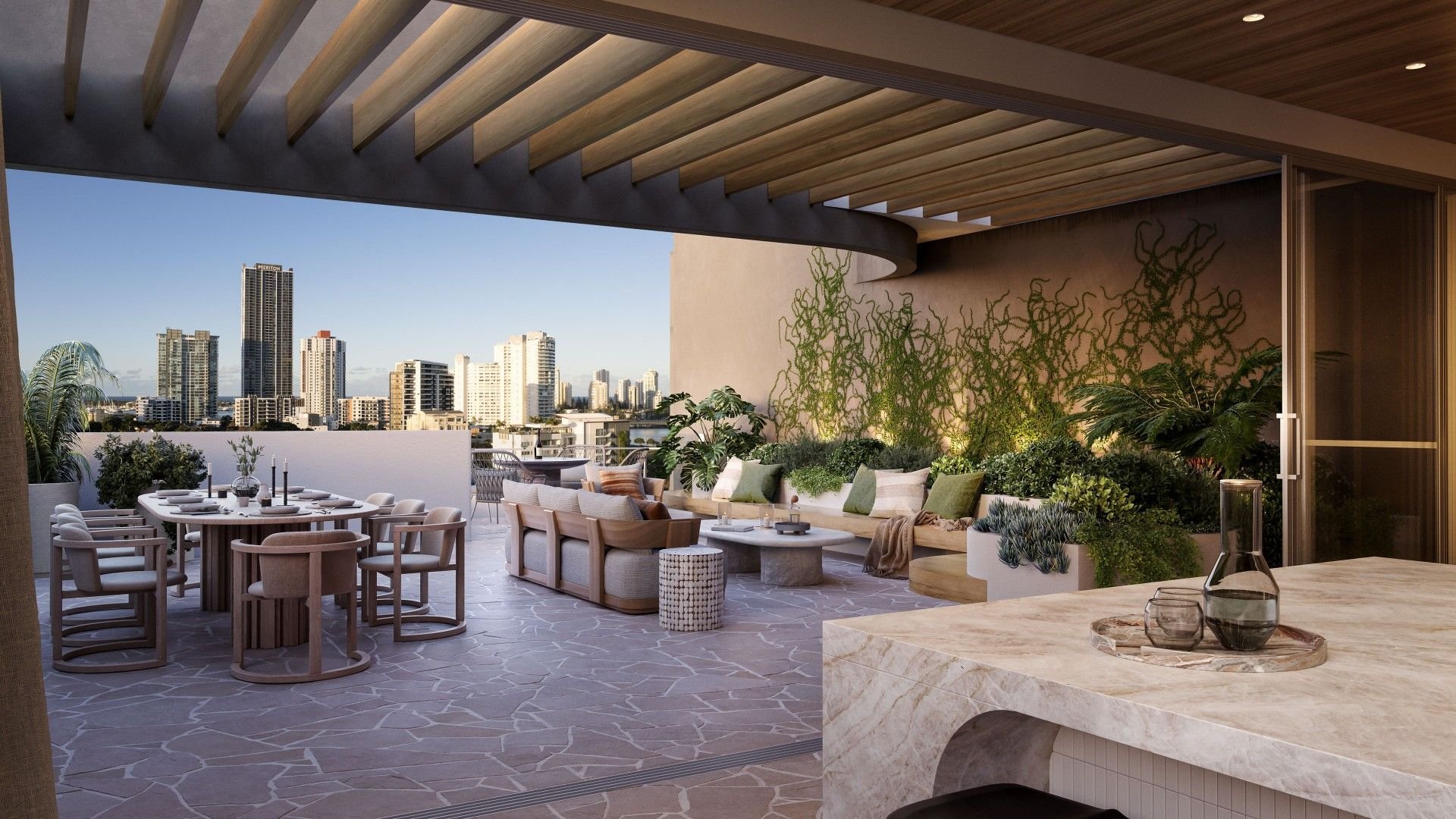 Modern rooftop terrace with dining table, chairs, and seating area, surrounded by plants, overlooking city skyline.
