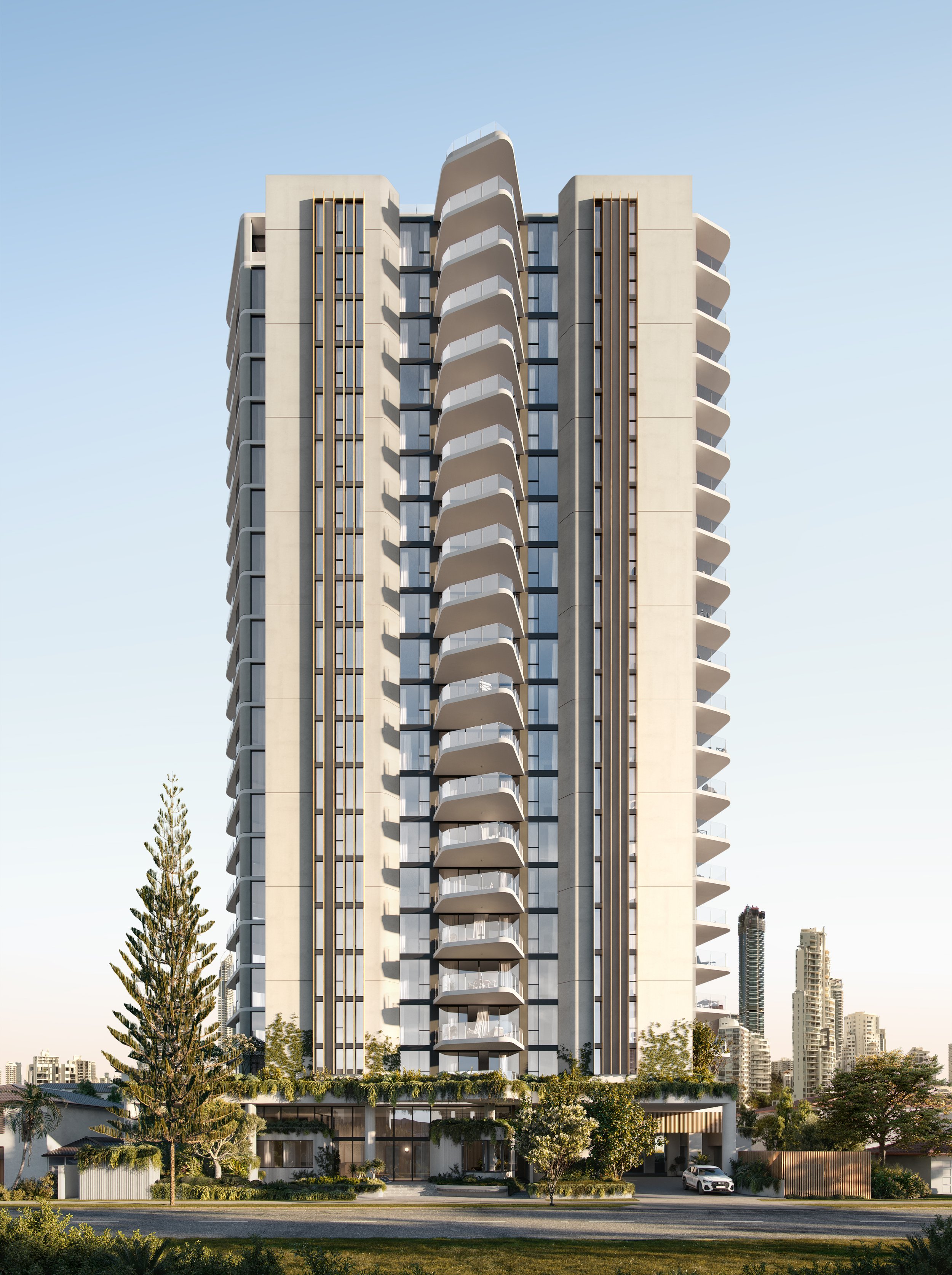 Modern high-rise apartment building with balconies, surrounded by greenery, against a blue sky.