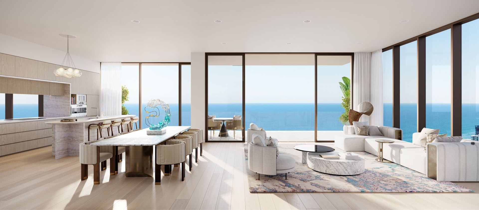 Modern open-concept living room and kitchen with ocean view, featuring floor-to-ceiling windows, sleek furniture, and contemporary decor.