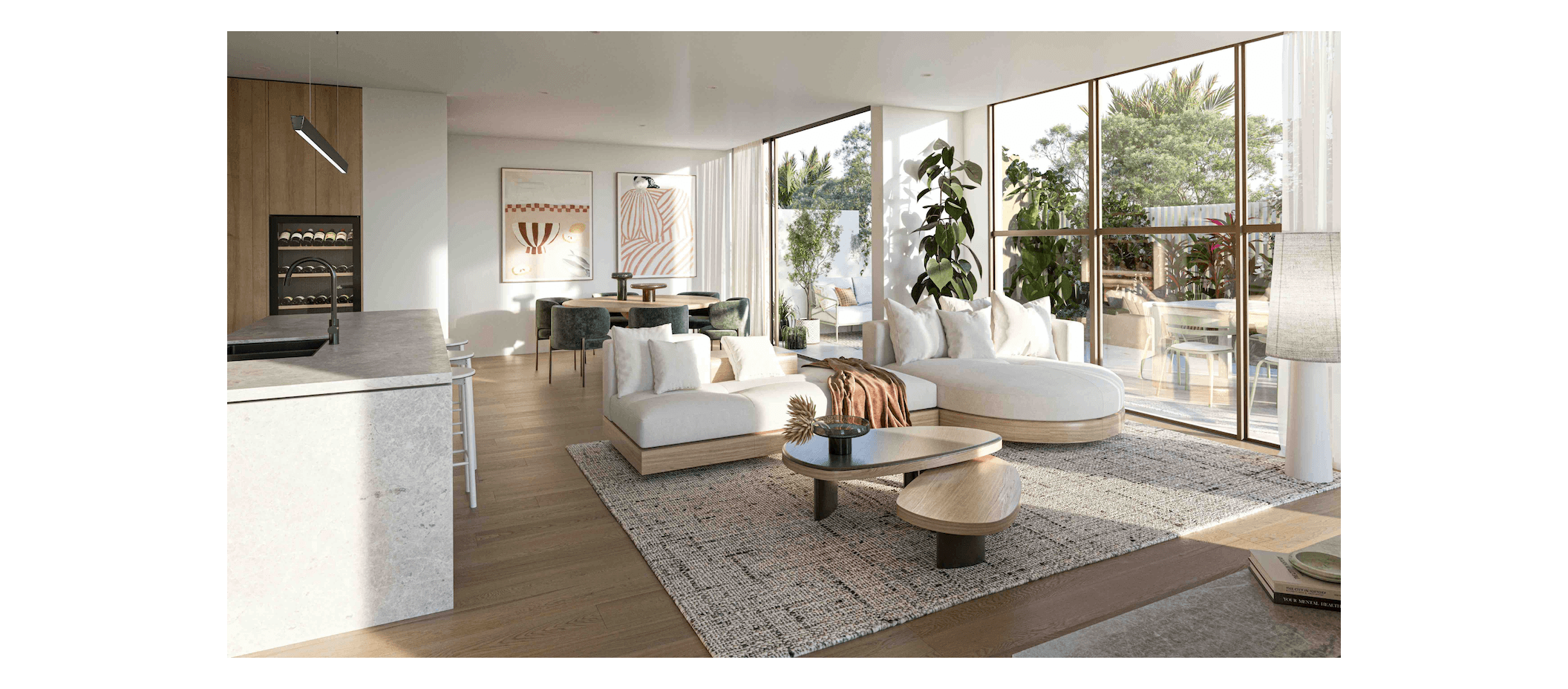 Modern open-plan living room with large floor-to-ceiling windows, white sectional sofa, coffee table, indoor plants, kitchen island with sink, and dining area with dark green chairs.