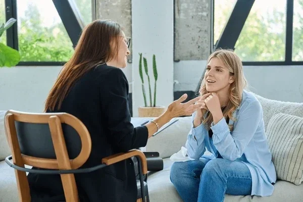 smiling on couch talking with your therapist