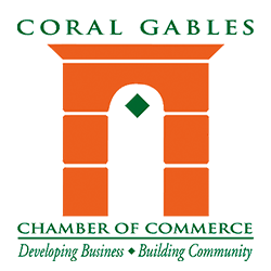 Logo for Coral Gables Chamber of Commerce with orange arch and green text.
