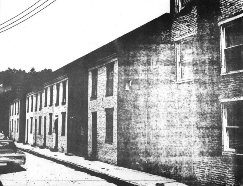 The 1100 block of Sarah Ann Street, these two-story rowhouses are a rare example of intact, well-preserved alley houses. (Poppleton Area Study, circa 1978)