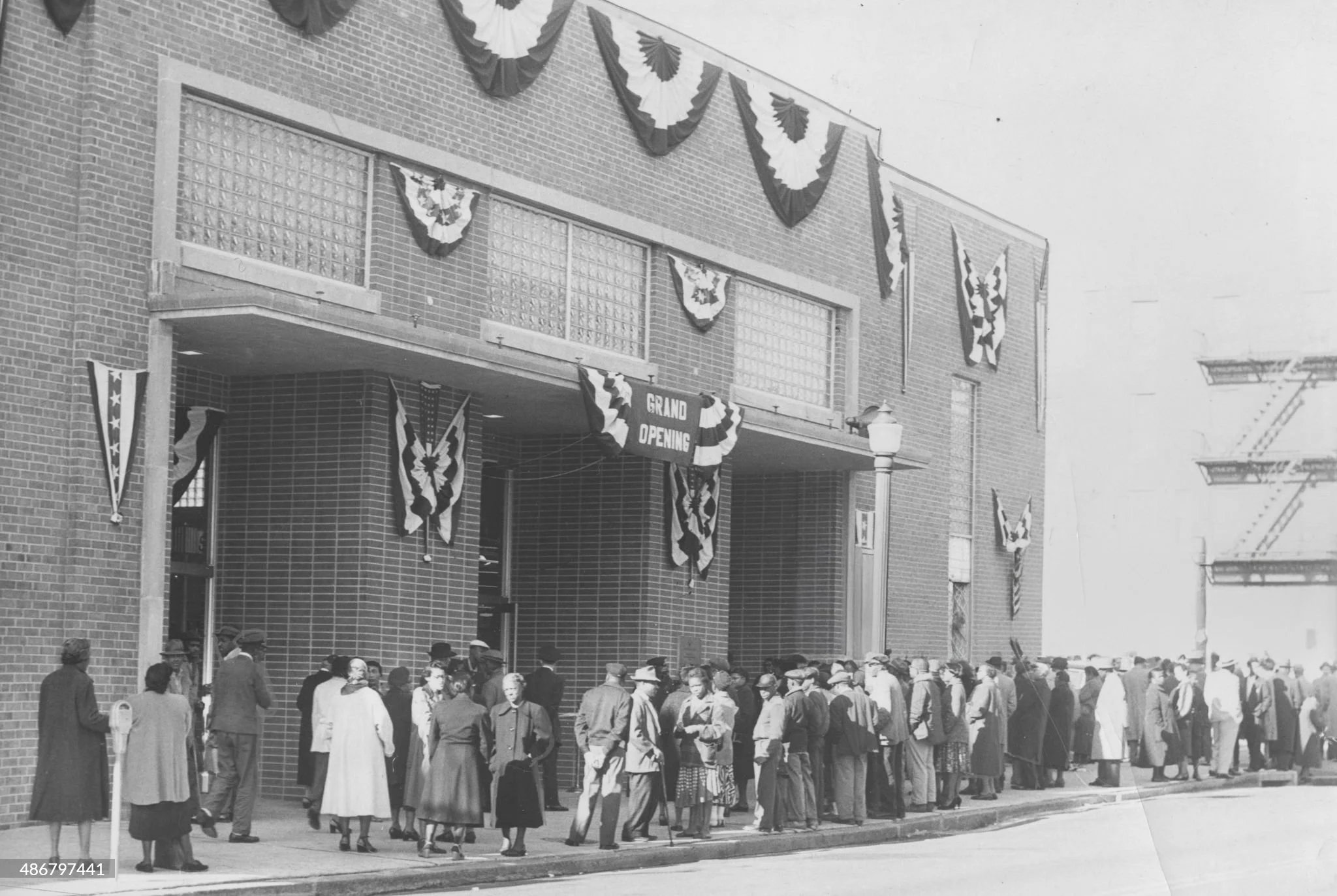 December 5, 1957 "A large crowd of men and women wait in line to attend the grand reopening of the Lafayette Market grocery and food market..." just in time for the holiday family feasts. (Afro American Newspaper)