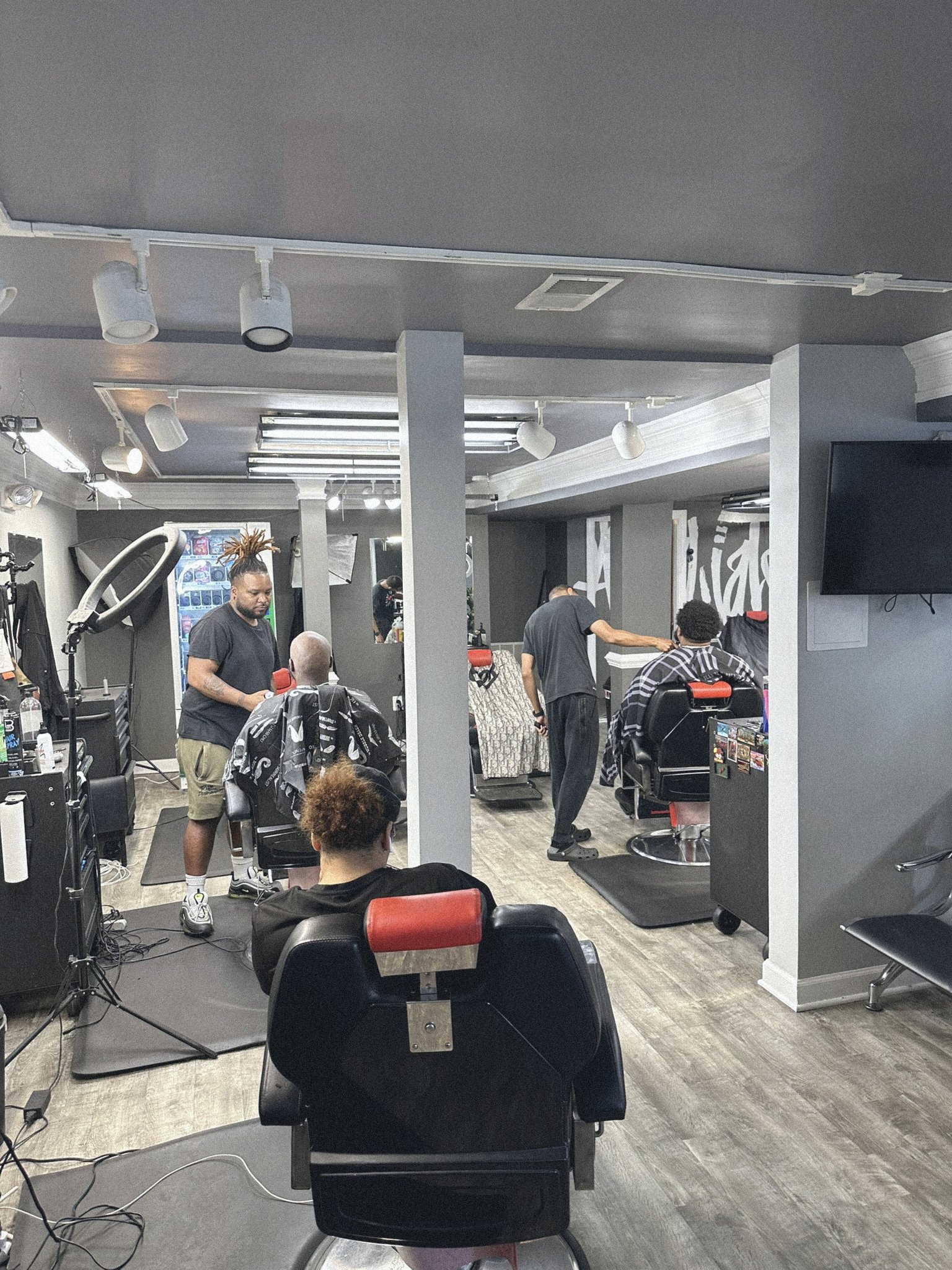  Affiliated Barbershop  
The building’s most recent history included a beloved community barbershop on the ground floor.  