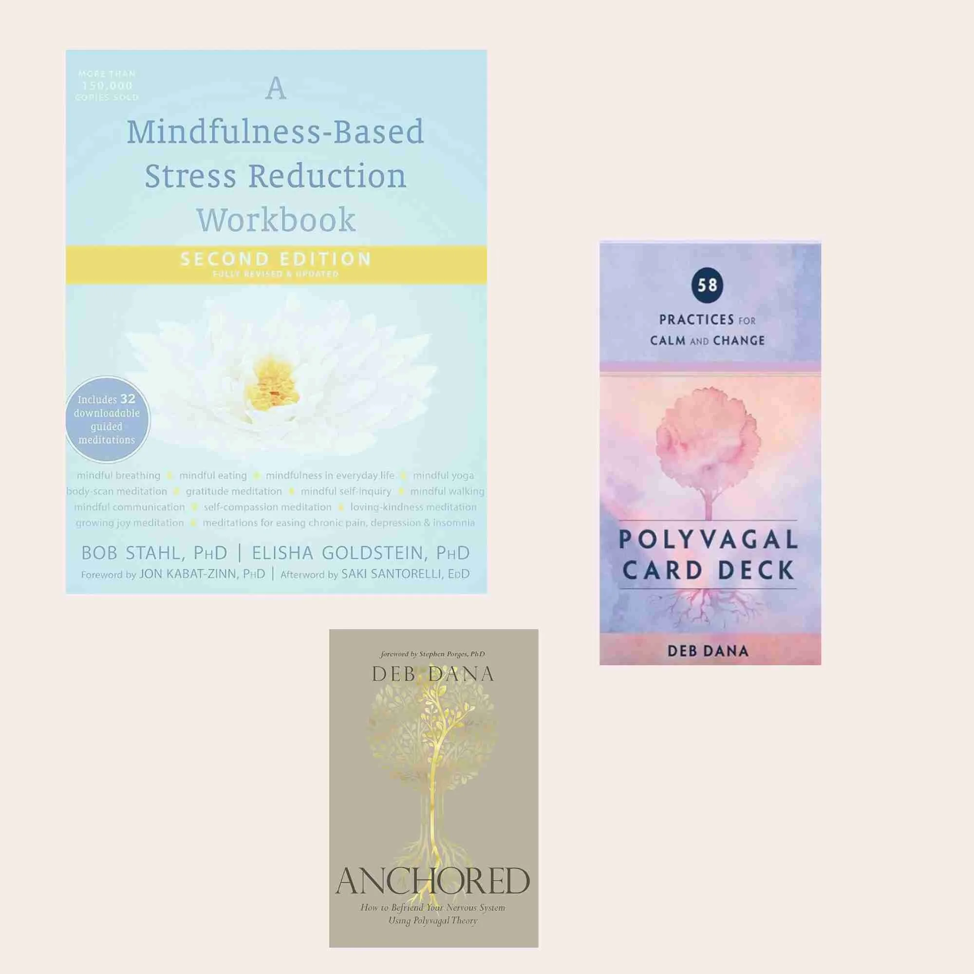 Three book covers on a beige background. The largest is "A Mindfulness-Based Stress Reduction Workbook," with a white lotus flower on a light blue background. To the right, a smaller cover titled "Polyvagal Card Deck" displays a pink and purple tree with roots. Below, a third book titled "Anchored" features a gold tree on a beige background.