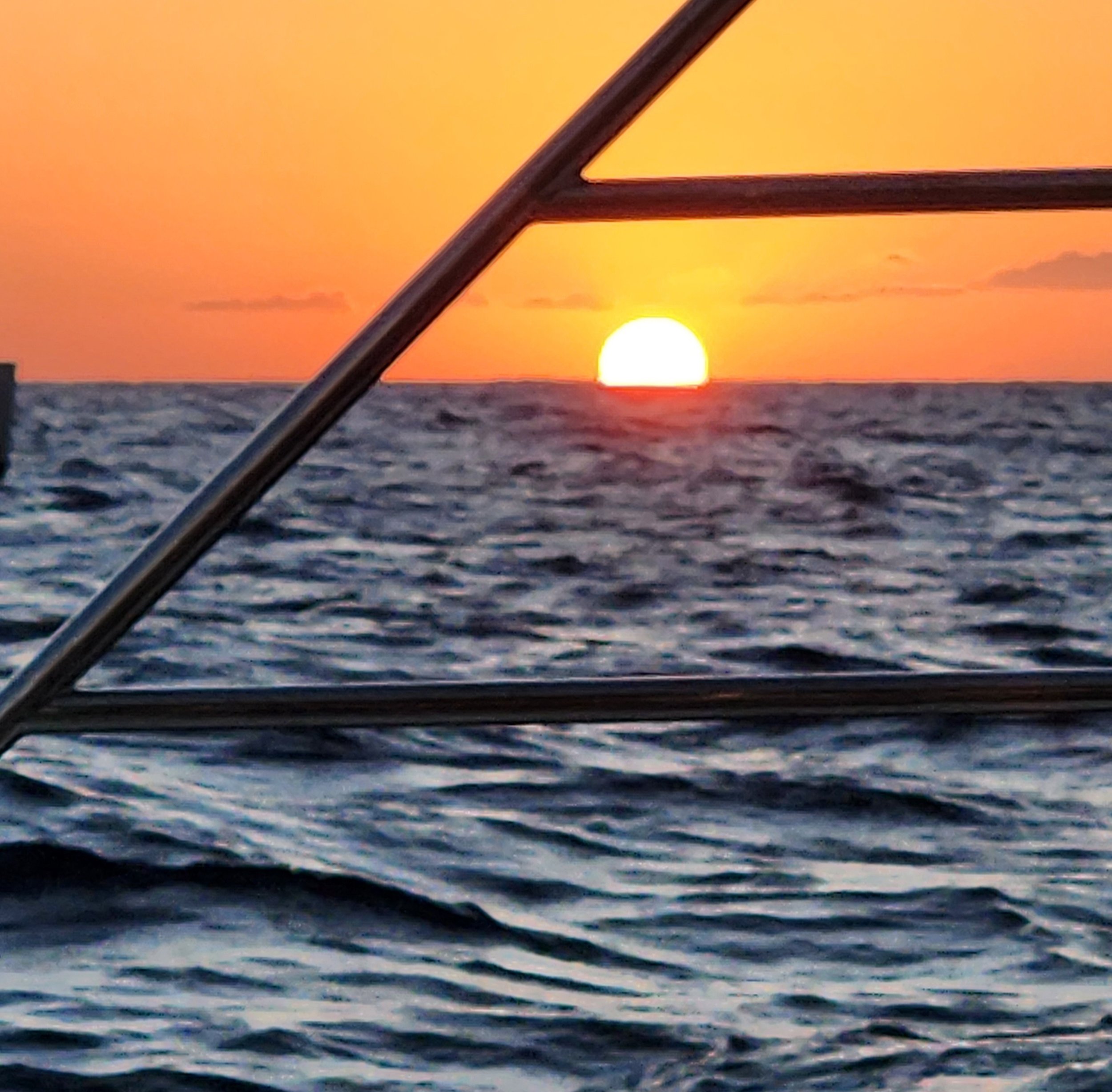 watching the sun set hoping to see the green flash at the horizon