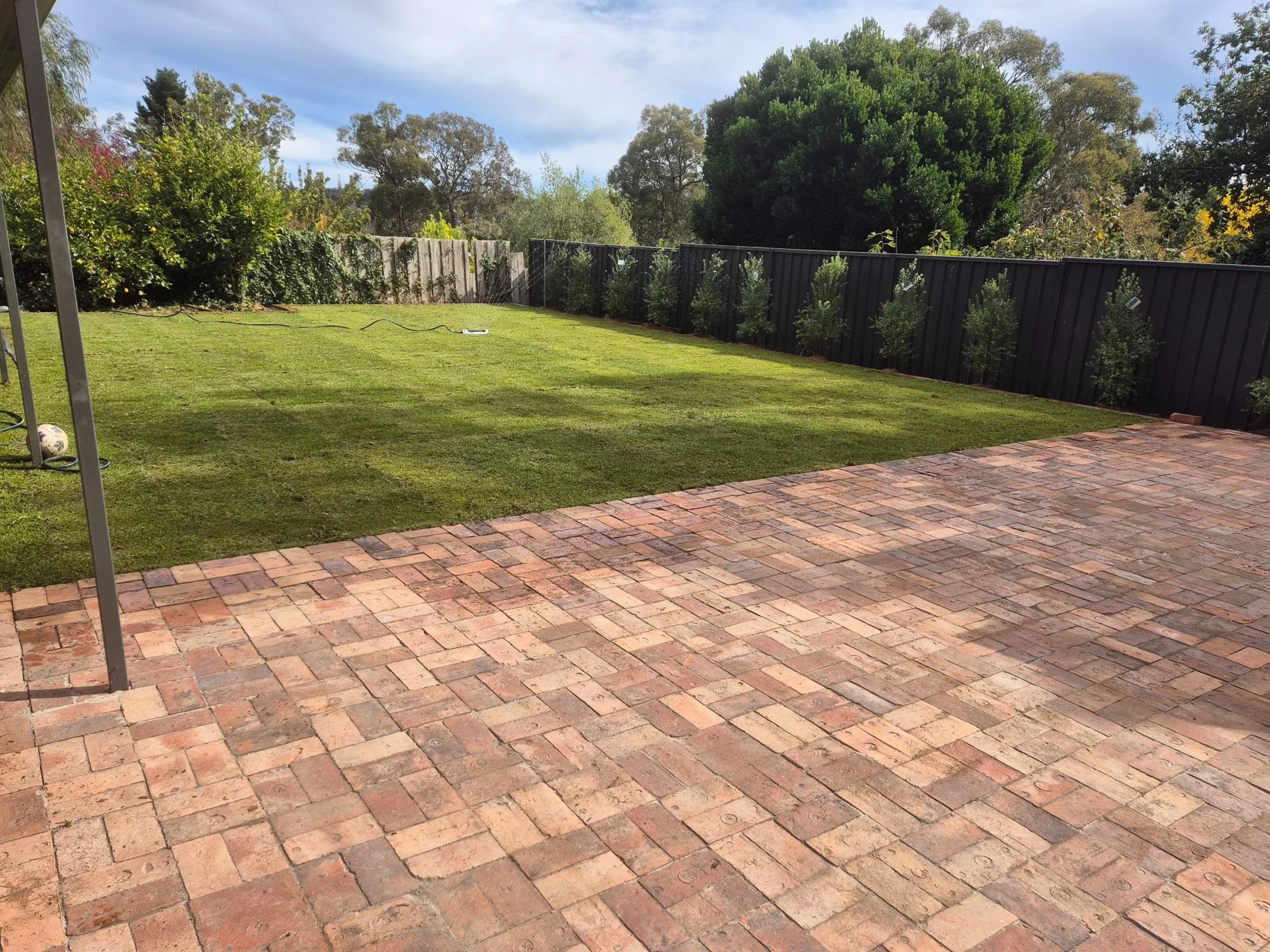 Fresh Lawn Installation with Brick Paving