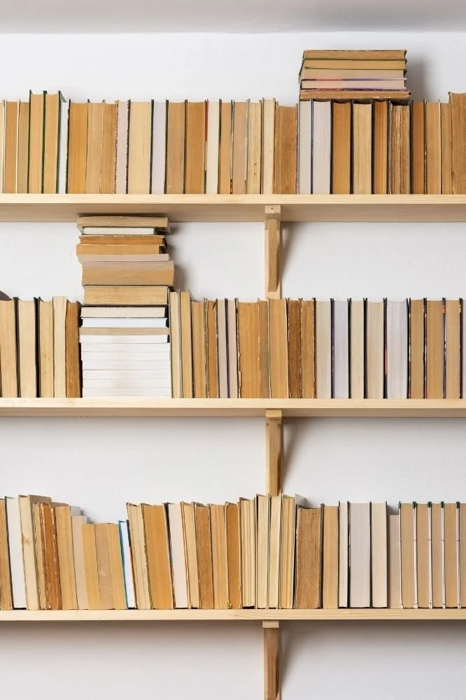 books stacked in a bookcase