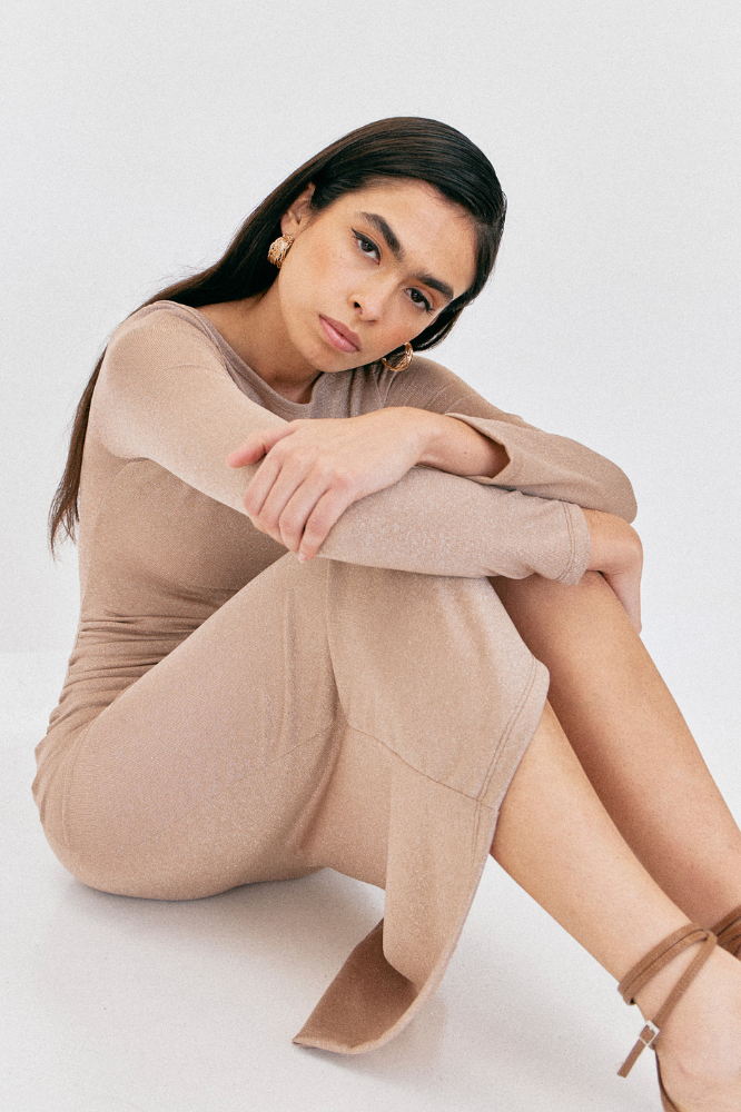 model in beige soft stretch midi dress with long sleeves
