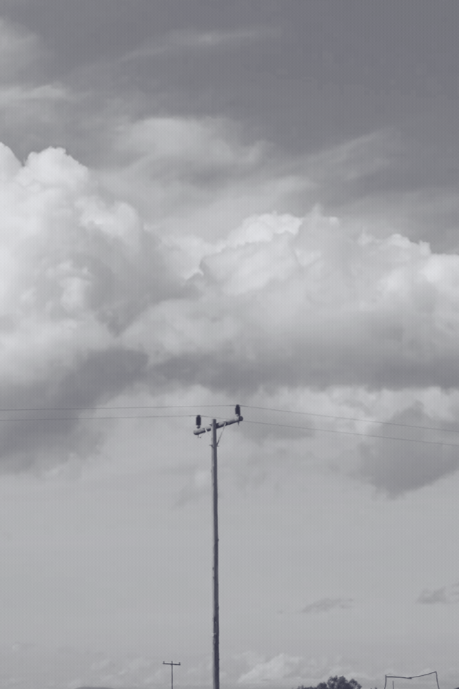 Clouds behind power lines