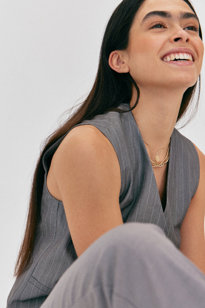 woman wearing pinstripe waistcoast