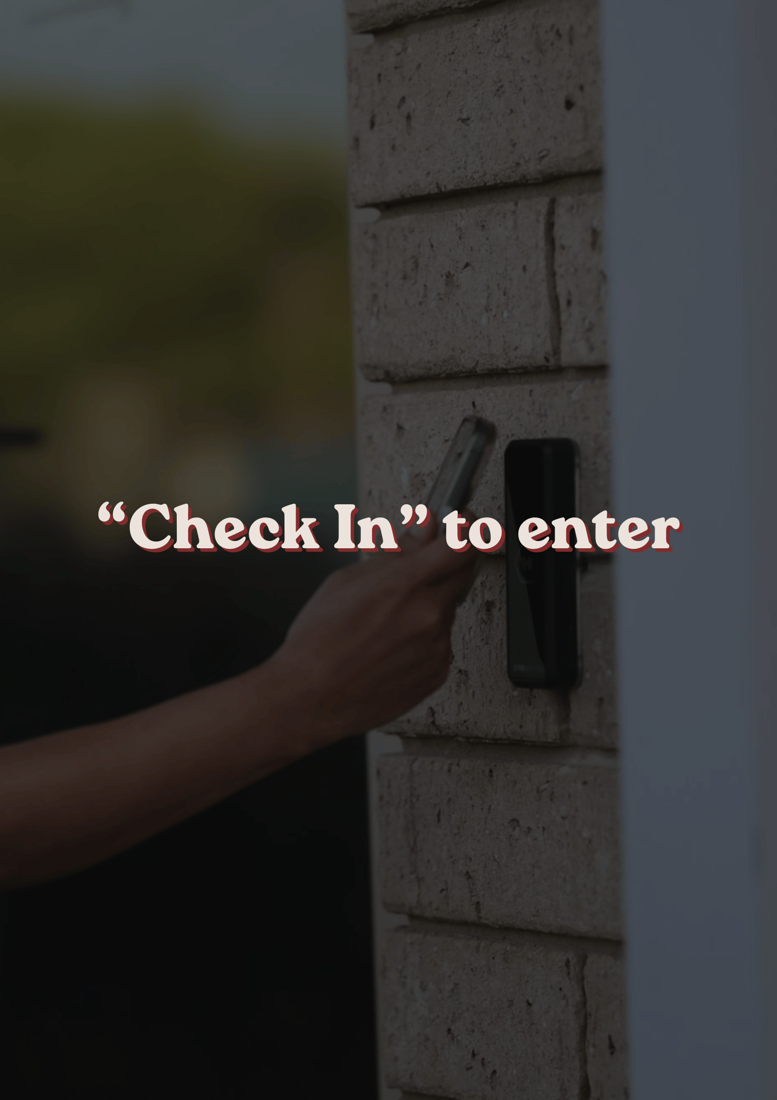 Close-up of a person pressing a doorbell button on a brick wall with the words 'Check In' to enter overlayed on the image.