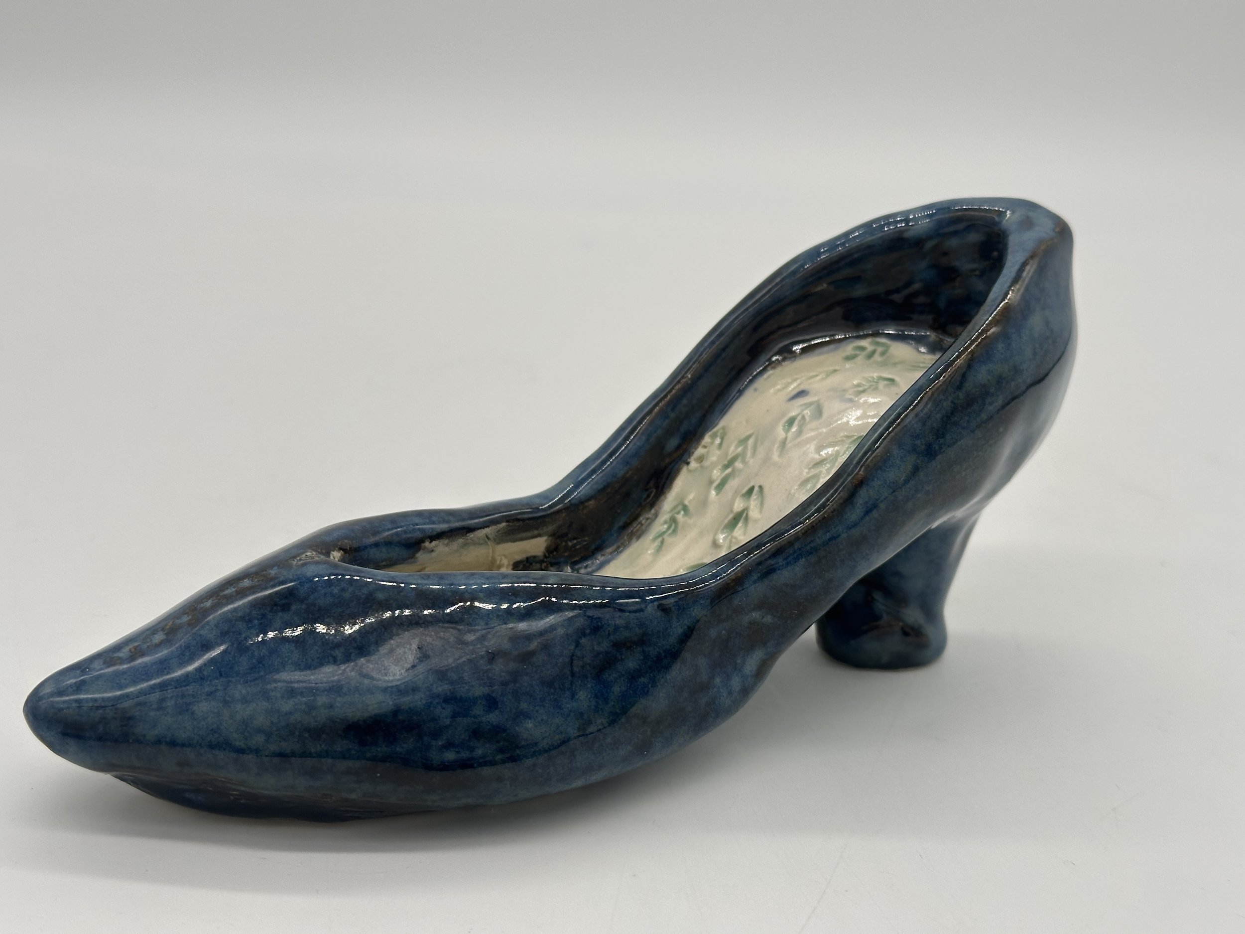 Completed student work, shows mastery in details and interesting glaze combinations for finishing.