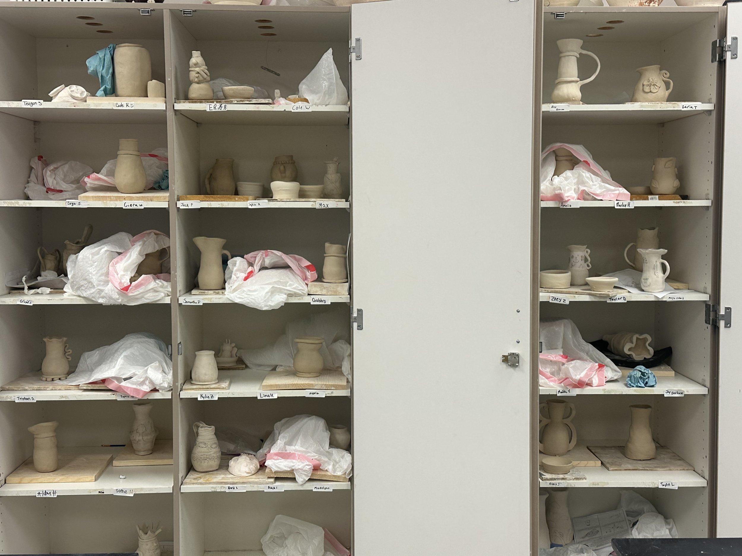 Student vases from 1 block drying out over the weekend, ready for underglaze.