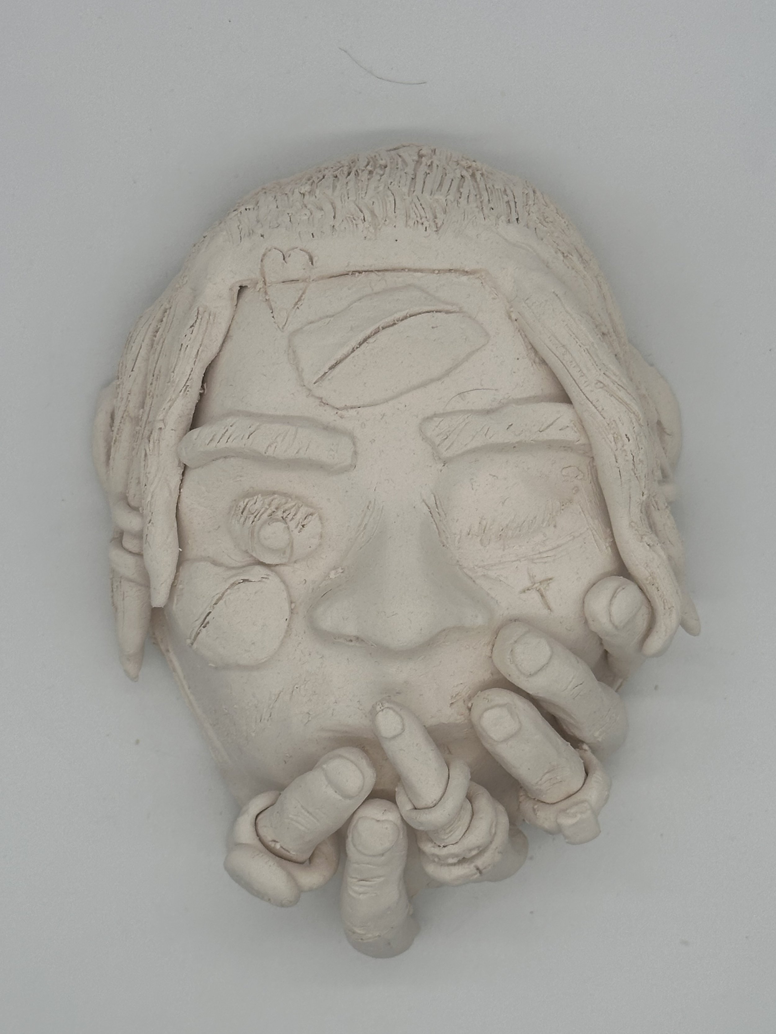 Bisqued Student mask with detailed features.