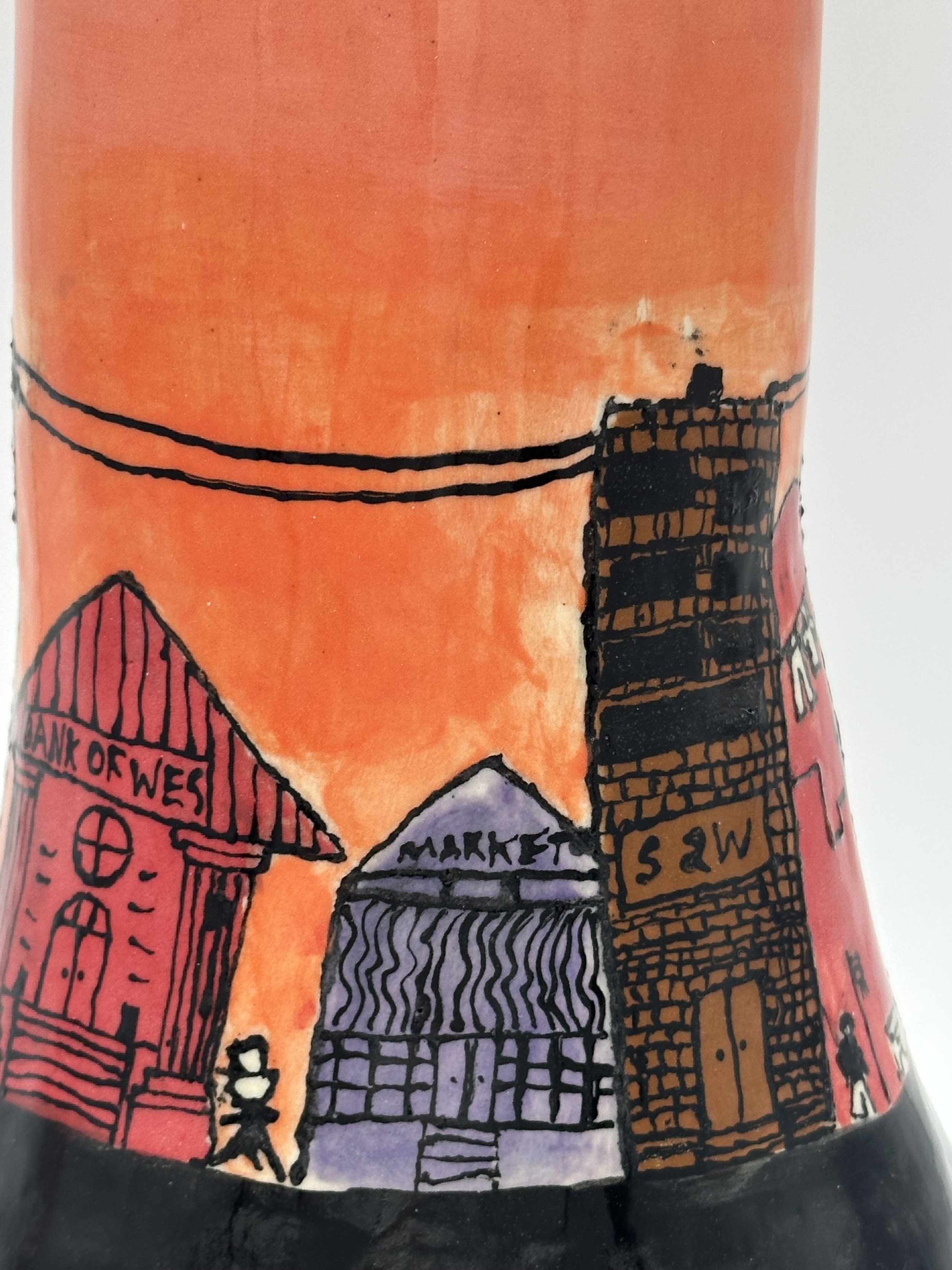 Detail shot of a large student vase (2 ft) with their city illustration underglazed and finished with clear.