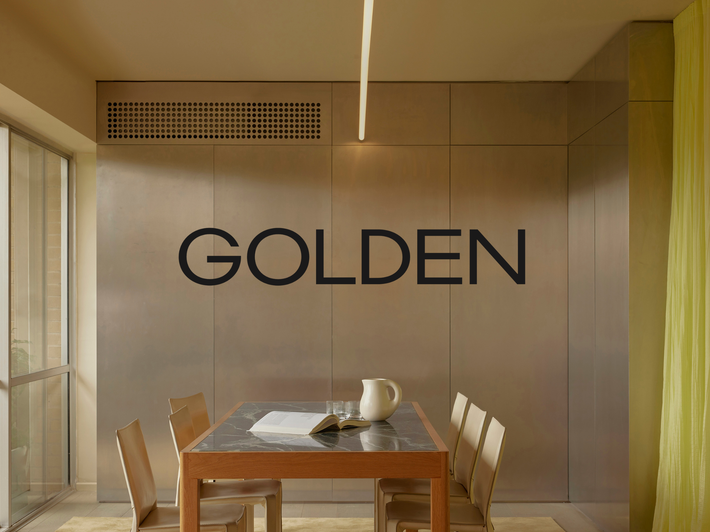 Image of boardroom table in designed room with GOLDEN logo overlay