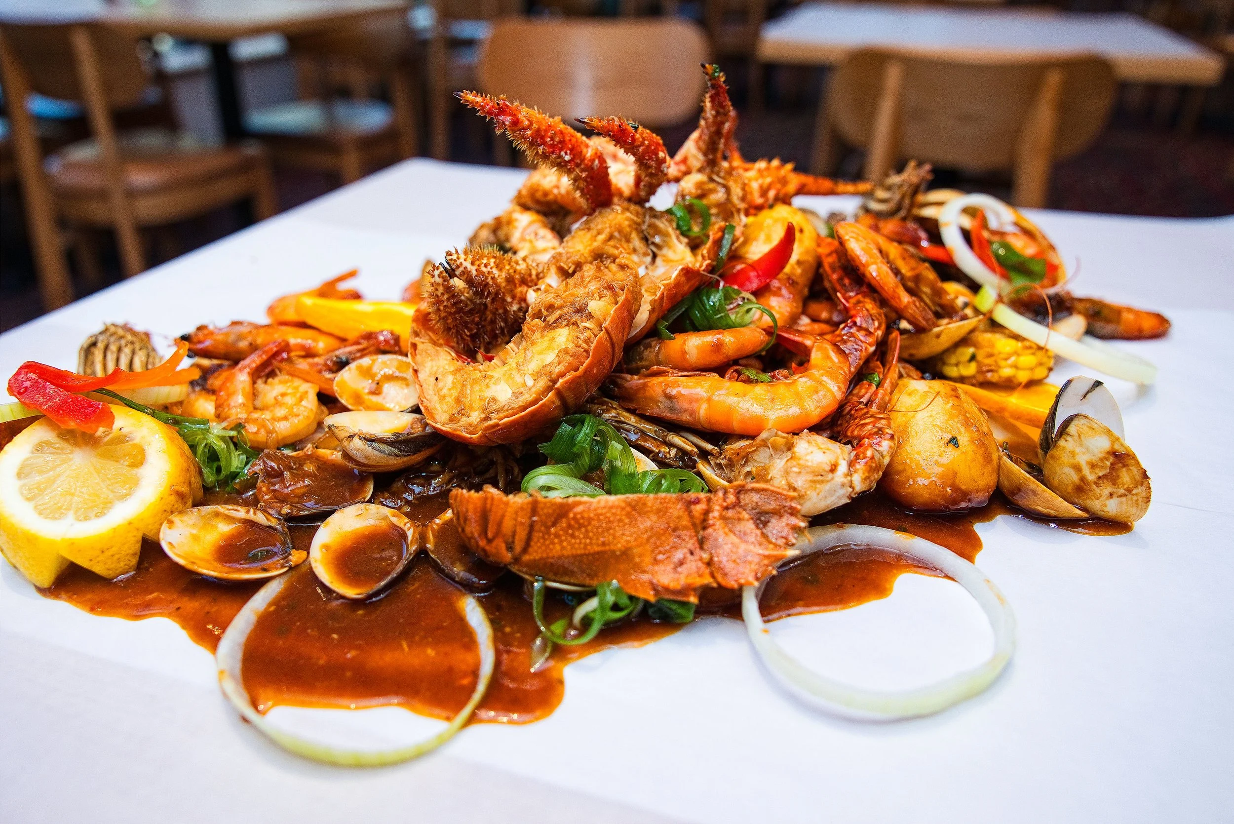 Signature seafood boil platter with mixed seafood, corn and potatoes at Lusso Tapas Blacktown