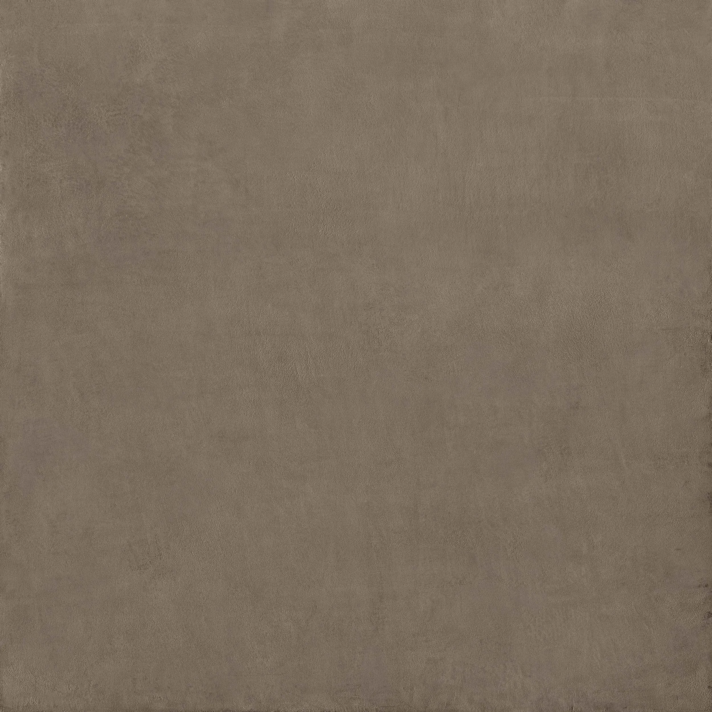 Een close-up van een beige/bruine textuur, mogelijk een muur of oppervlak.