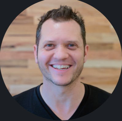 Man smiling wearing black v neck shirt