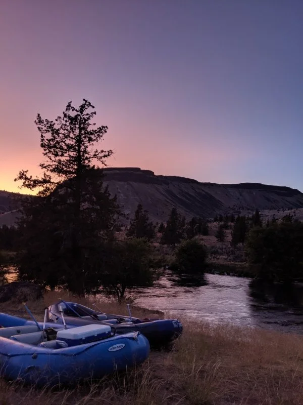 2 rafts on the river banks at sunset