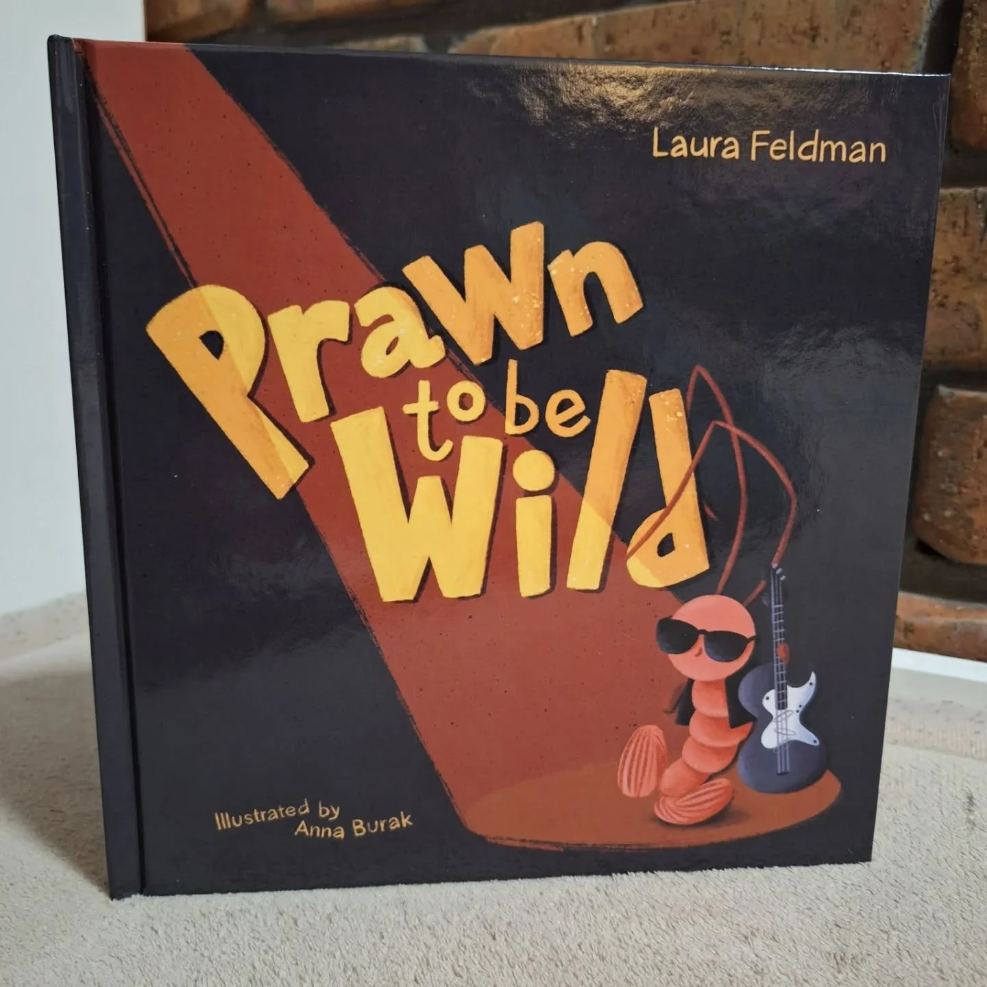 At #onceuponcon I was fortunate enough to get my hands on "Prawn to be Wild" by 'The Queen' Laura Feldman @little.ivory.haus, as part of our blind book swap! 
What. A. Cute. Book! Shawn the prawn dreams of being a guitarist in a rock band!