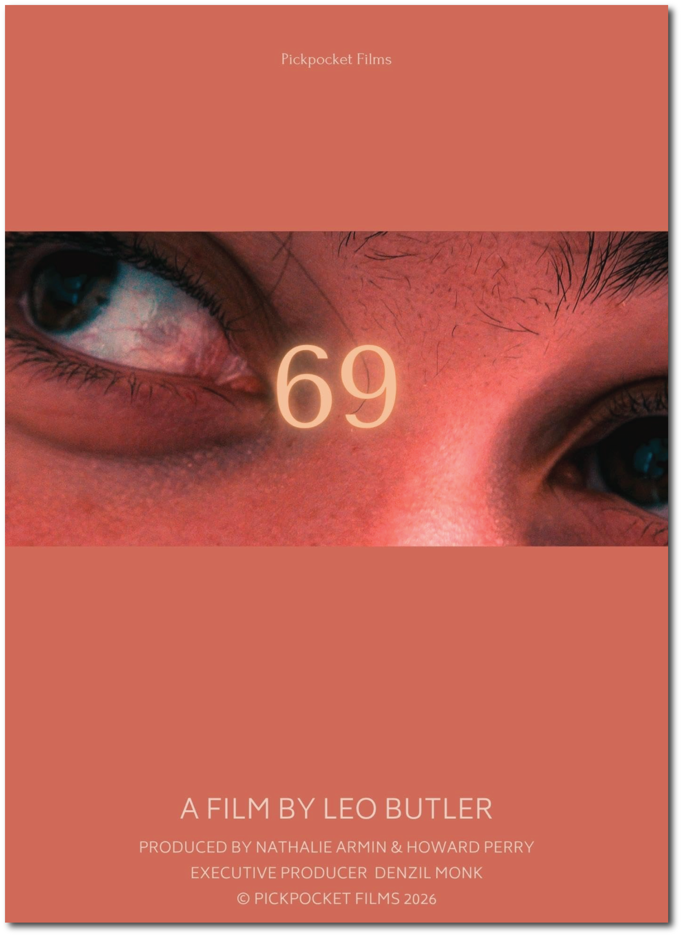 Close-up of a person's eye and surrounding skin with freckles and eyebrow hairs, overlaid with text indicating the film is by Leo Butler, produced by Nathalie Armin & Howard Perry, executive producer Denzil Monk, produced in 2026.