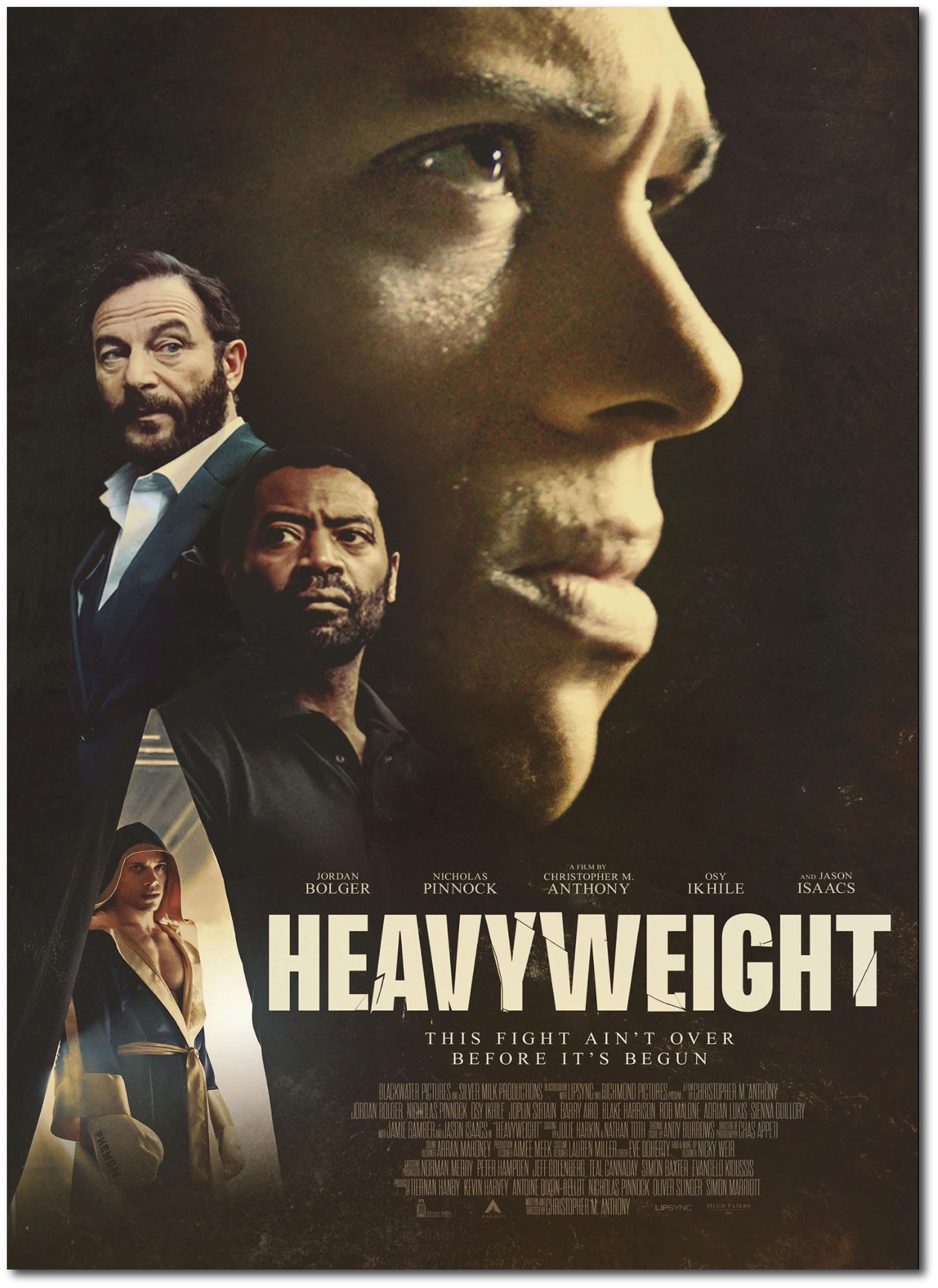 Movie poster for 'Heavyweight' featuring close-up of a woman's face in profile background, with three male actors in the foreground, and a woman in a boxing outfit on the bottom left. The title 'Heavyweight' and tagline 'This fight ain't over before it's begun' are visible.