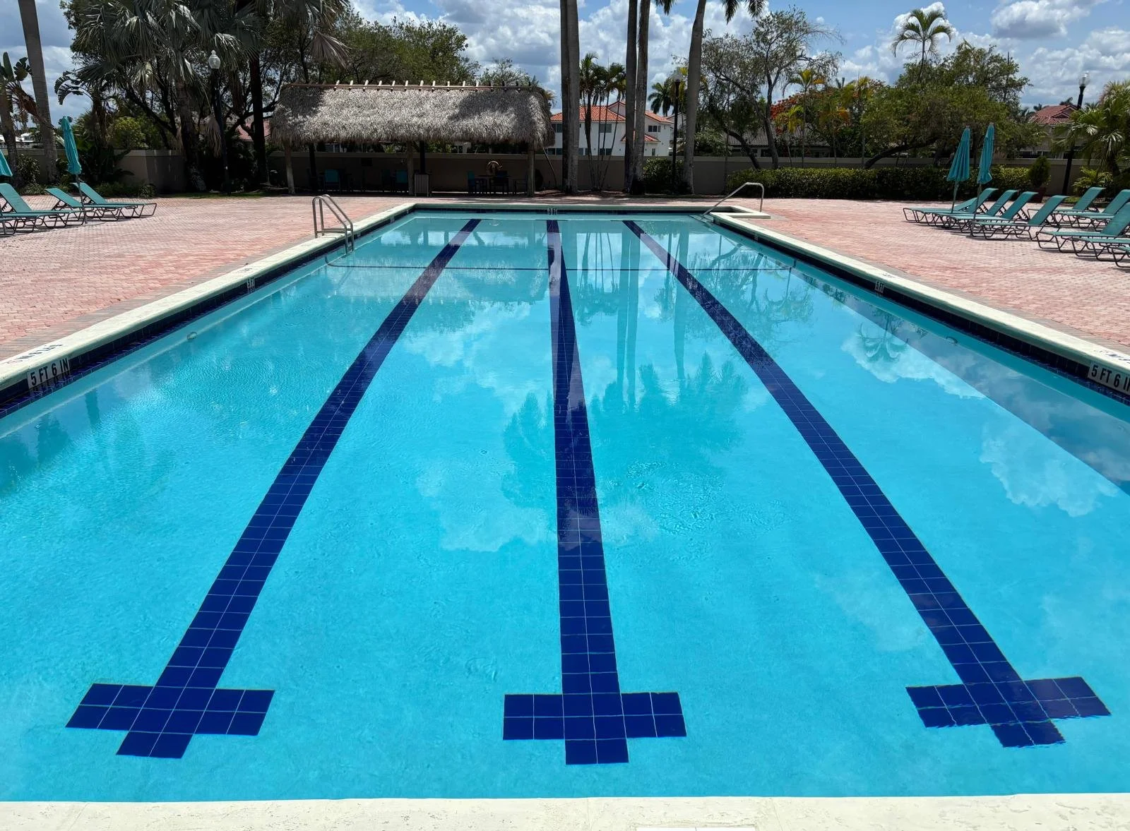 Crystal clear swimming pool maintained by Lux Pools