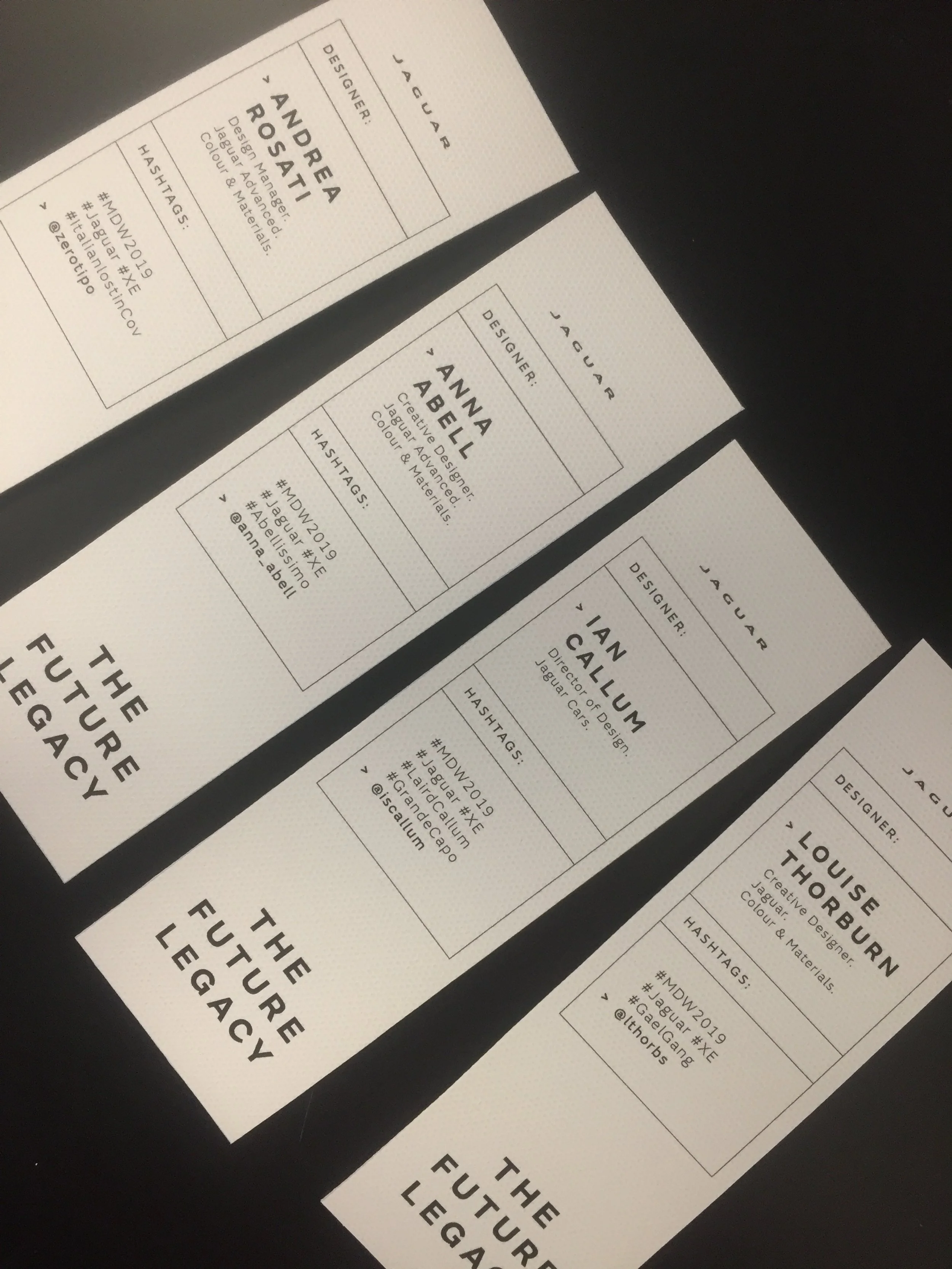 Bookmarks featuring designer information and hashtags for a Jaguar event titled 'The Future Legacy'. Names listed include Andrea Rosati, Anna Abell, Ian Callum, and Louise Thorburn.