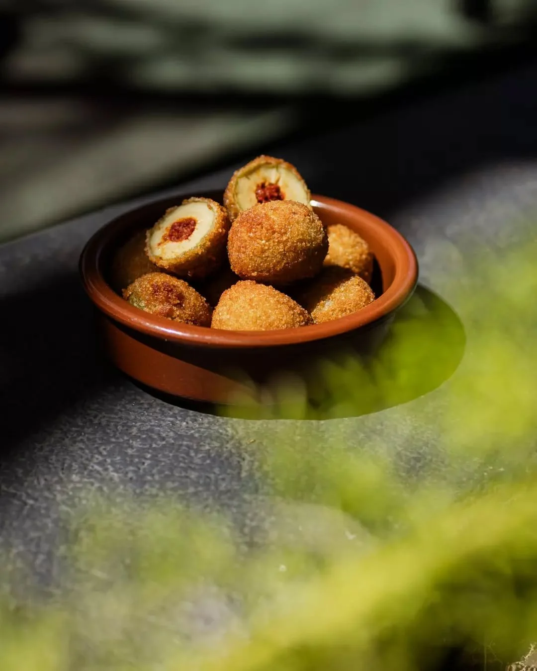 Jumbo green olives stuffed with nduja, crumbed and fried.