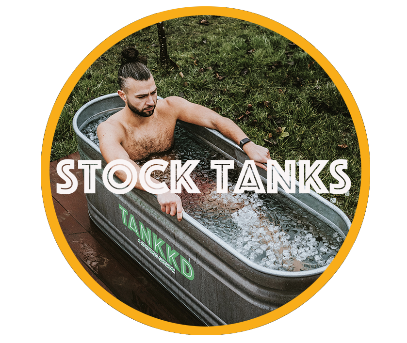 A man relaxing in a stock tank filled with ice and water outdoors, surrounded by grass, with the text 'STOCK TANKS' overlaid.