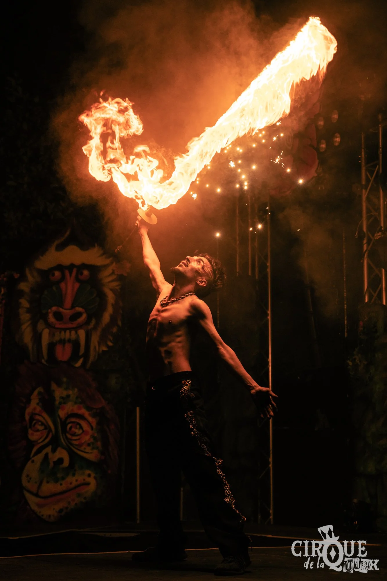 Zen MacPherson performing fire sword at Cirque de la Quirk, Isle of Wight Festival