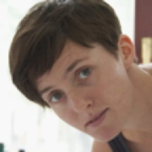 Person with short hair looking at the camera
