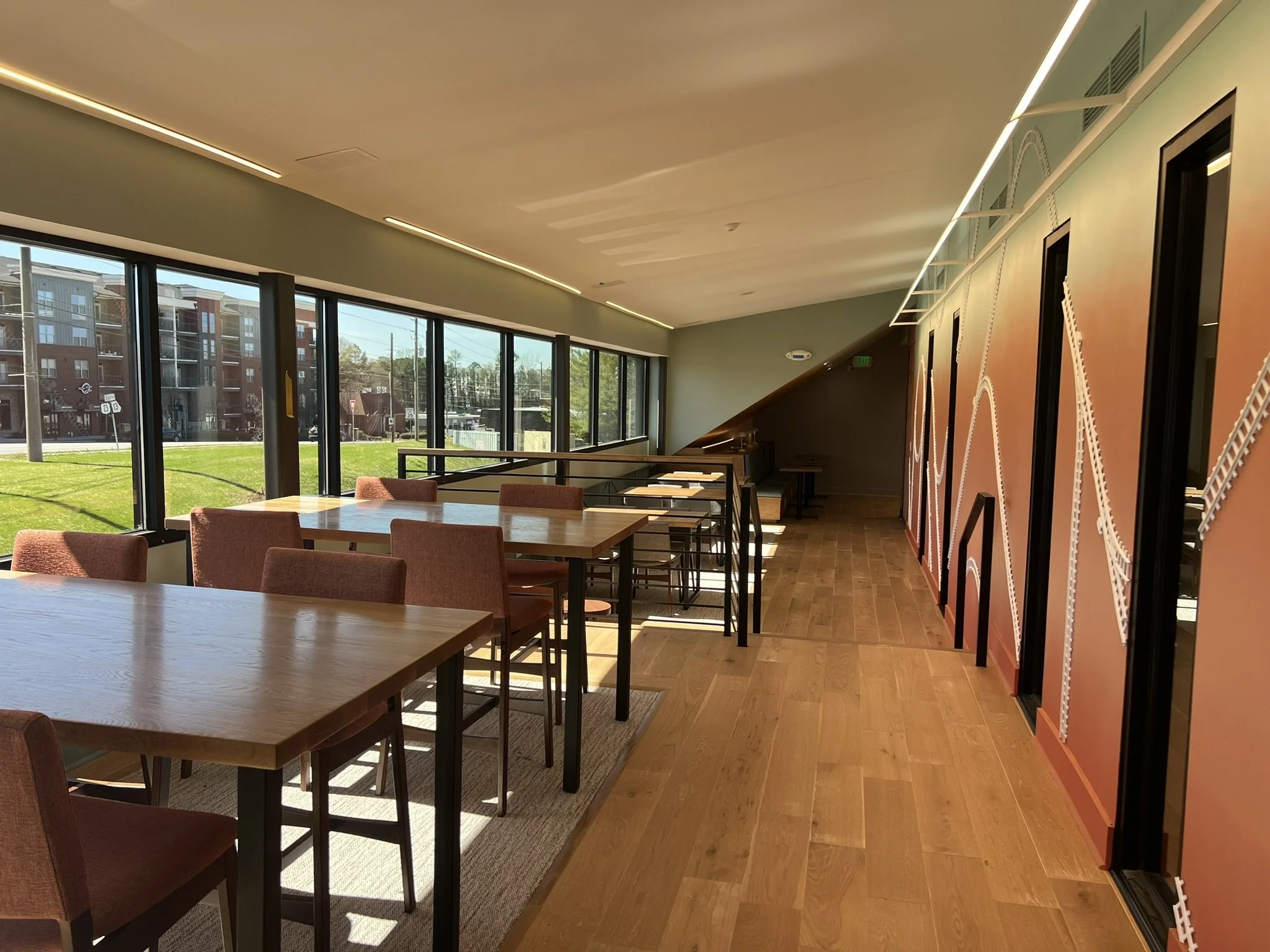  The completed ribbon window transforms the second floor into a coworking environment, where natural light washes over collaborative spaces. 
