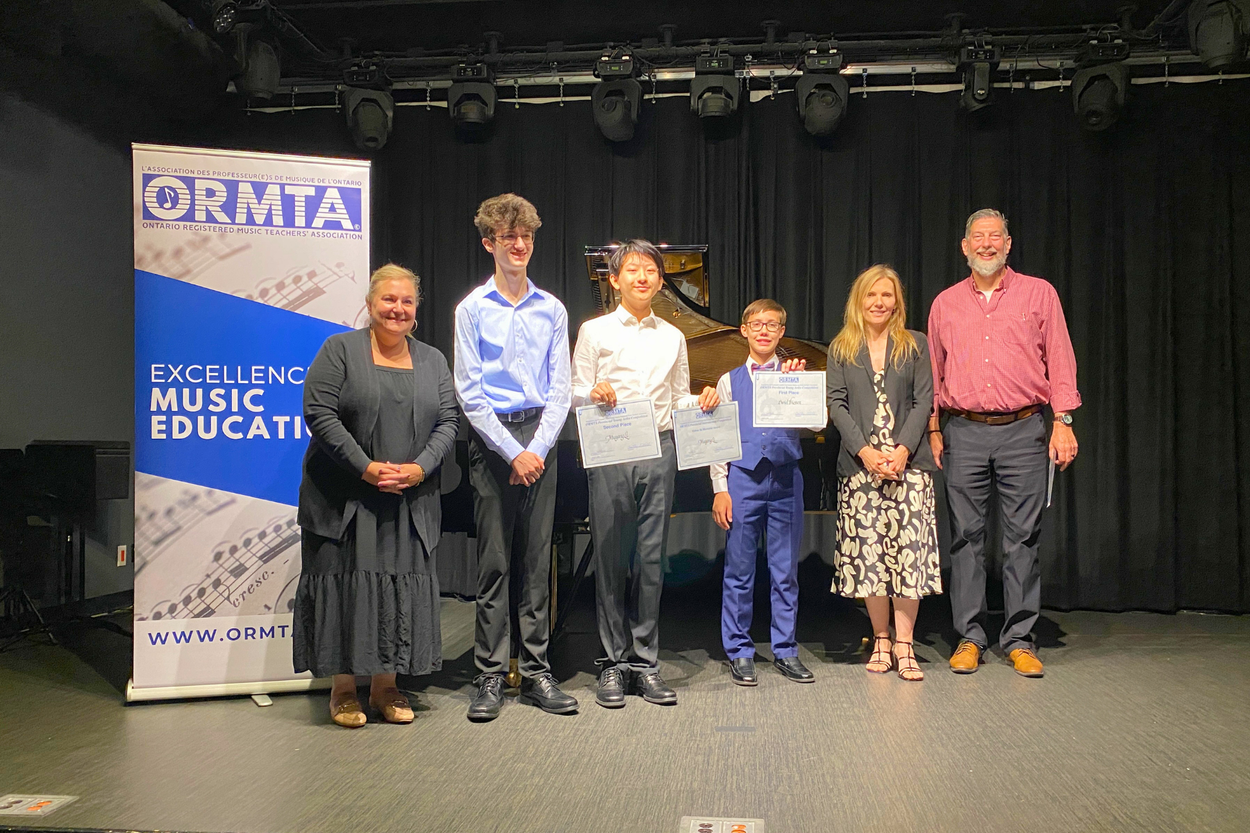 Young Artist Competition winners and competitors, with the adjudicators and ORMTA Board Chair, Tania Granata (far left)