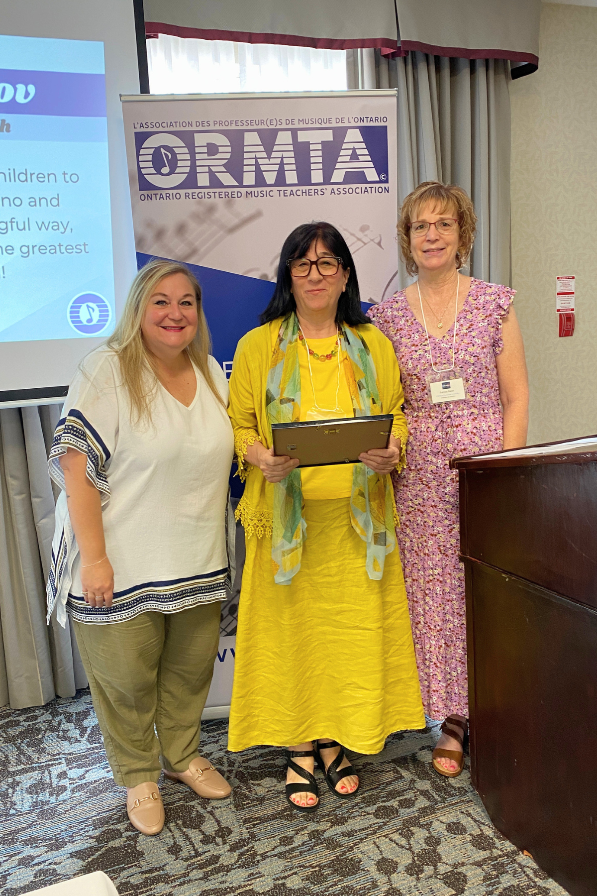 OCTA Recipient Iana Ahilov, with ORMTA Board Chair Tania Granata, and OCTA/Pedagogy Convenor Patricia Baker.