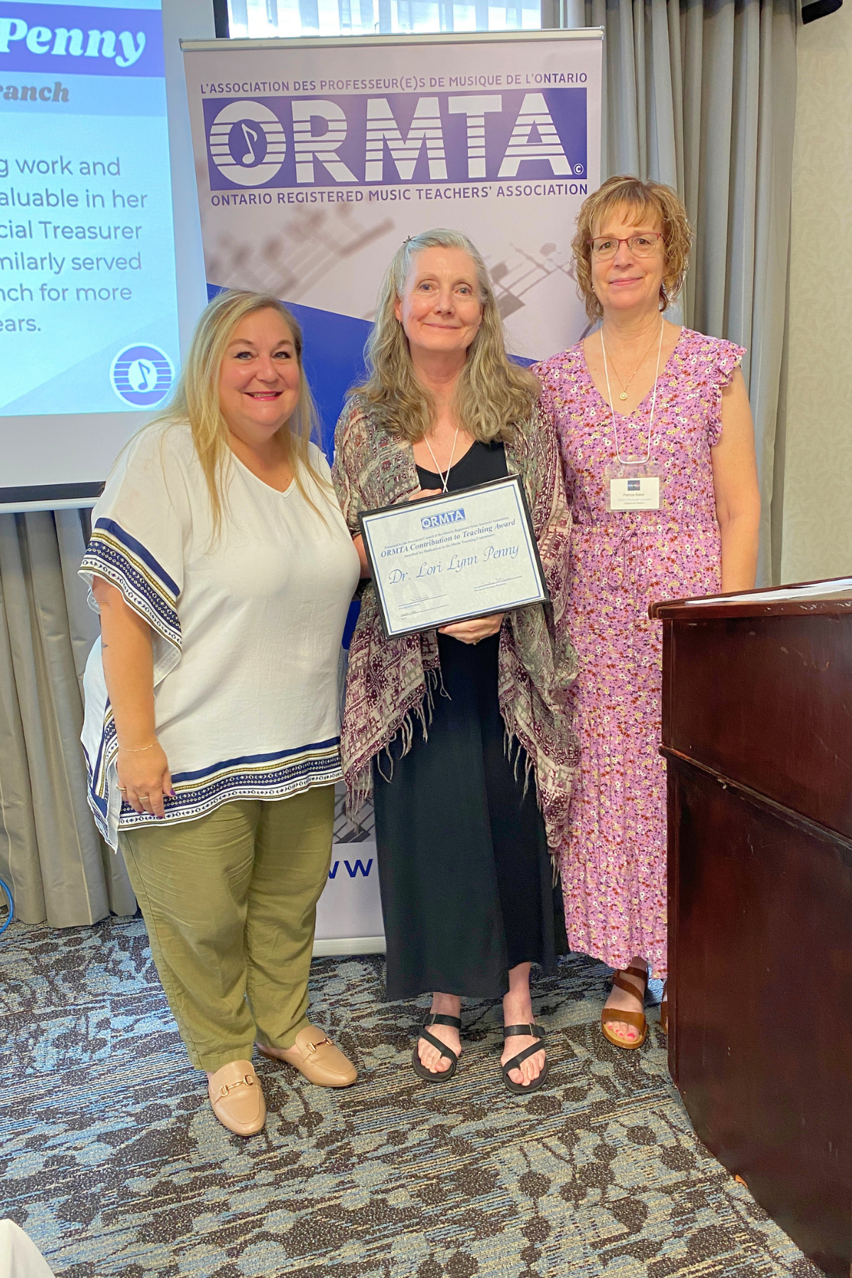 OCTA Recipient Dr. Lori Lynn Penny, with ORMTA Board Chair Tania Granata, and OCTA/Pedagogy Convenor Patricia Baker.