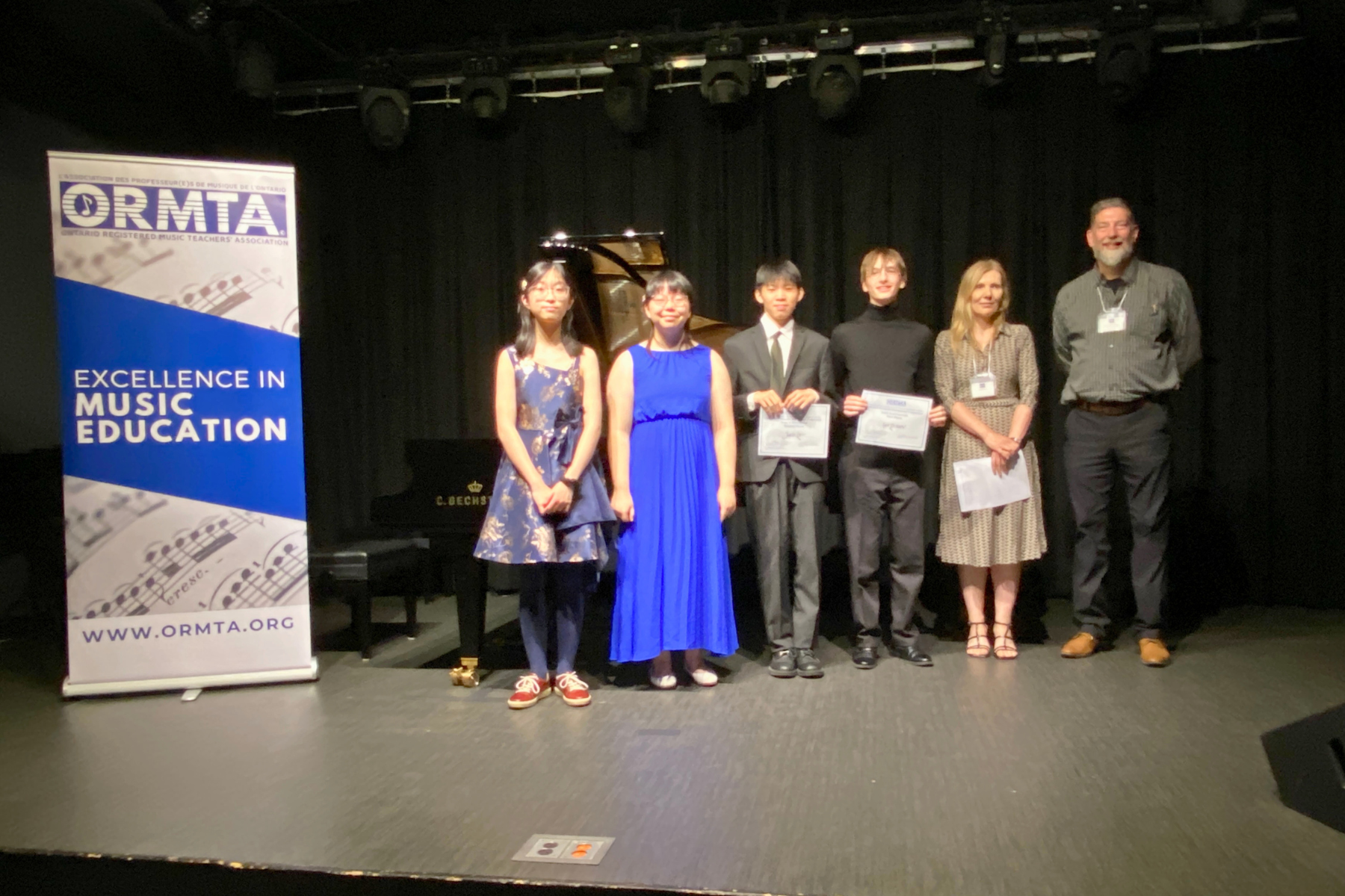 Level 10/Associate Piano Competition winners and competitors, with the adjudicators